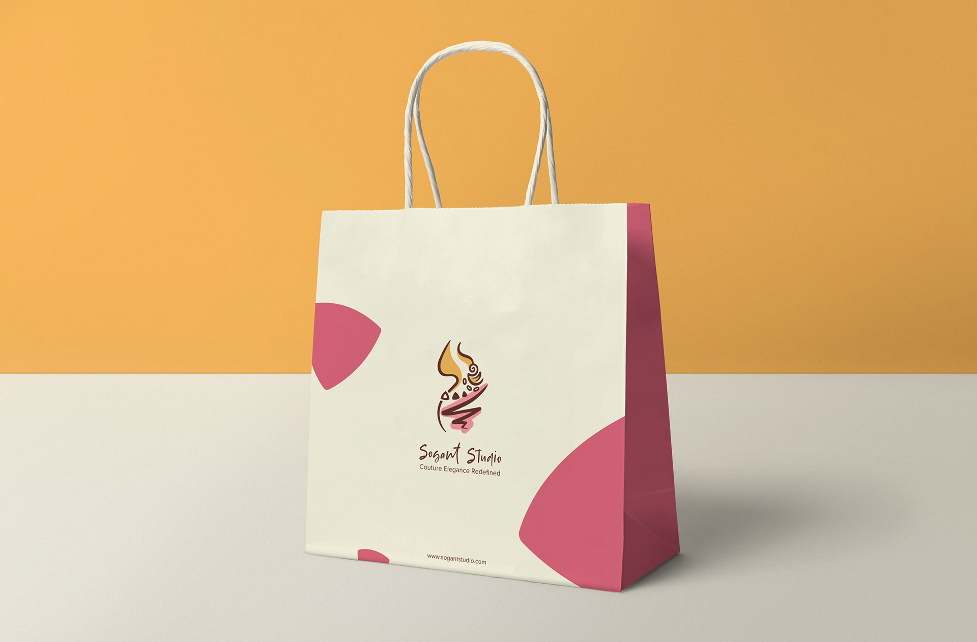Sogant Studio couture branding: shopping bag on mustard background