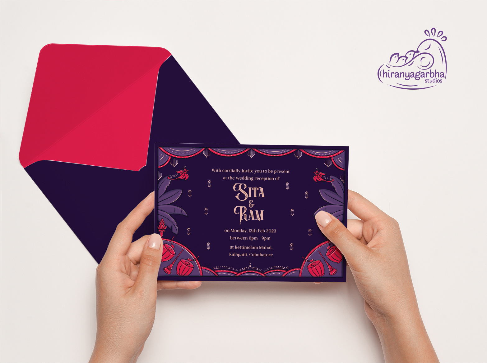 Sita Kalyana Vaibogame Brahmin wedding invitation: hands holding the invitation back with a red envelope