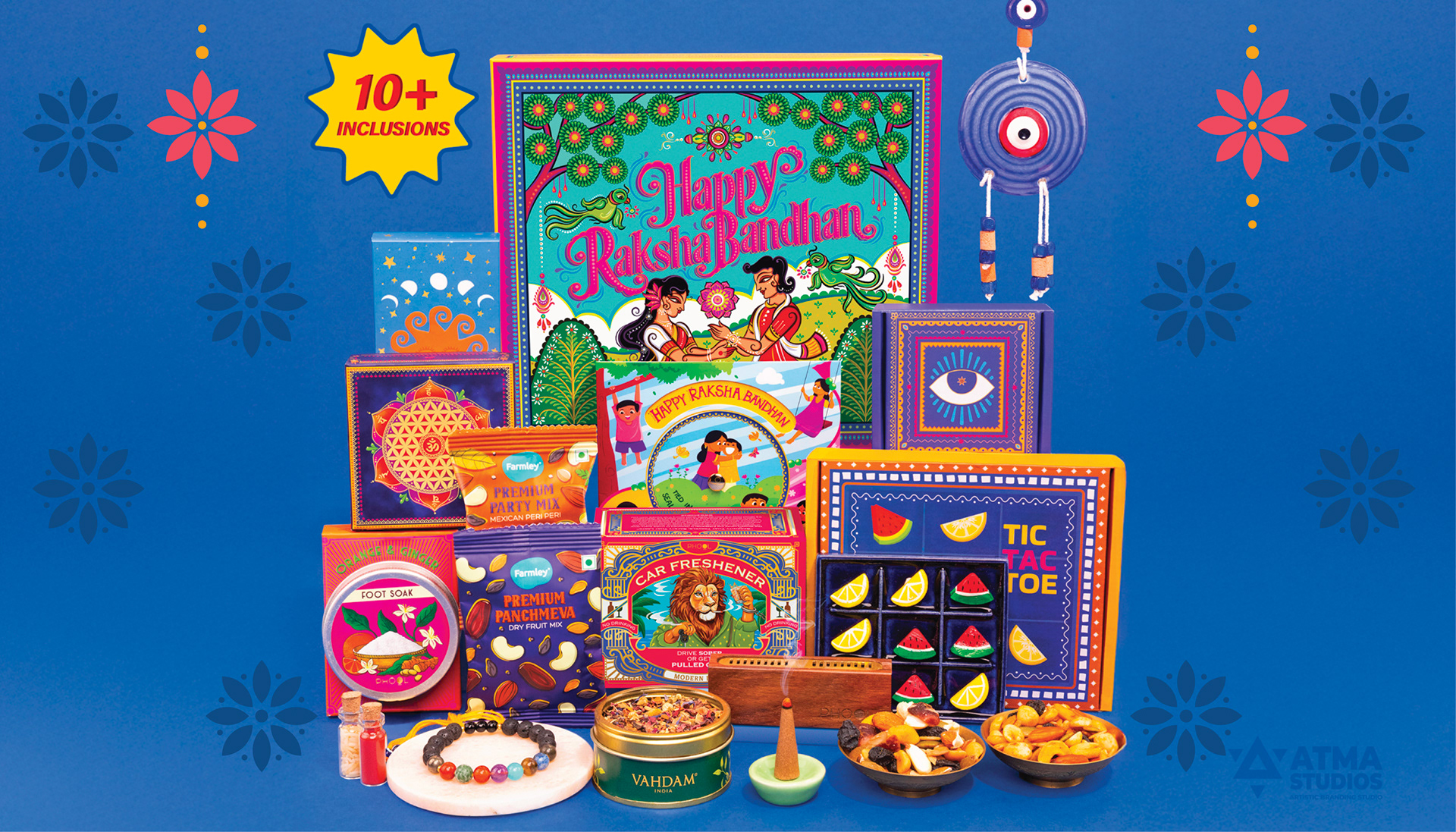 Phool Raksha Bandhan gift box packaging: gift box with incense, diyas and festive products on blue