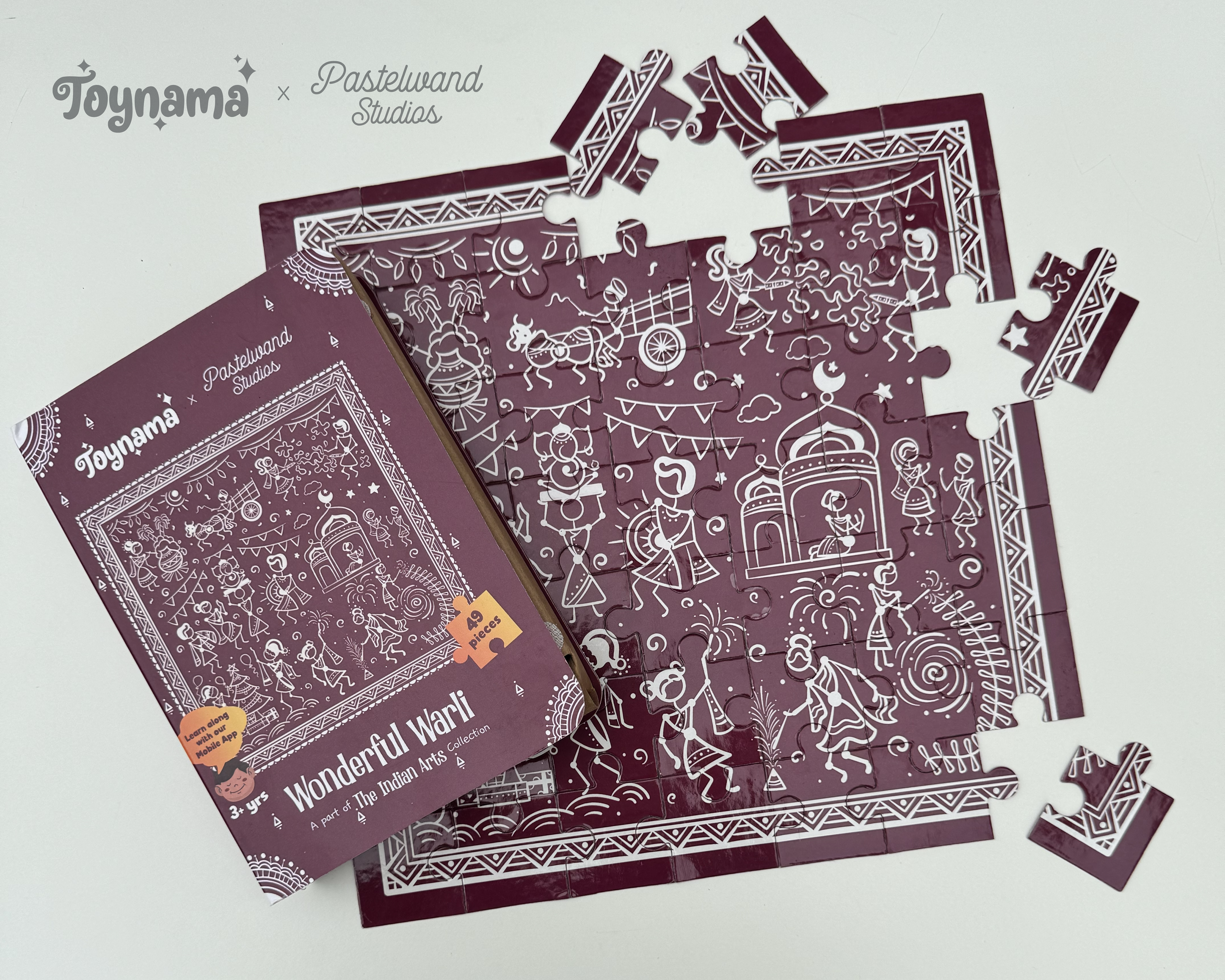 Arts of India jigsaw puzzles for Toynami: Warli jigsaw puzzle box with scattered pieces