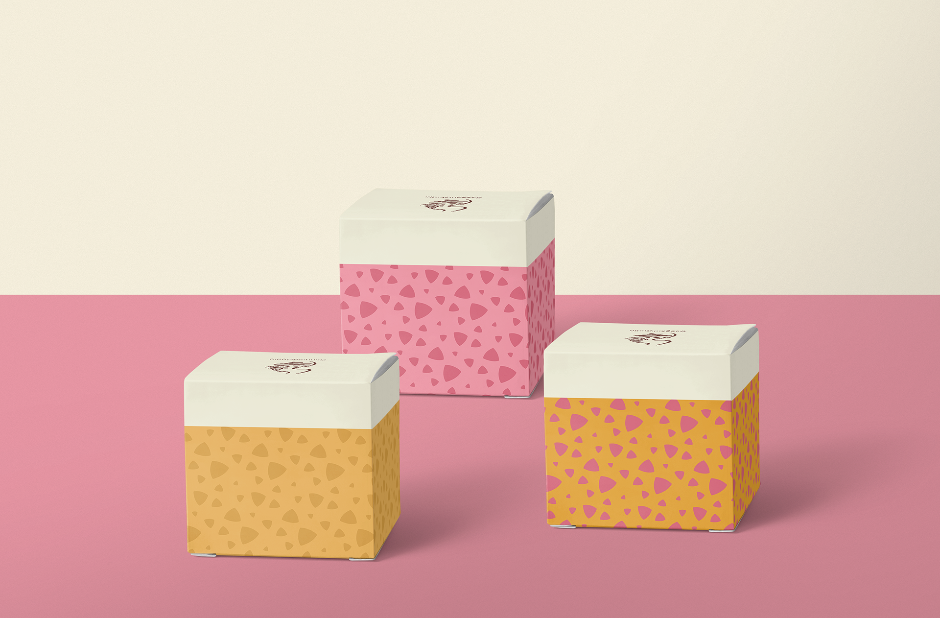 Sogant Studio couture branding: patterned gift boxes on pink