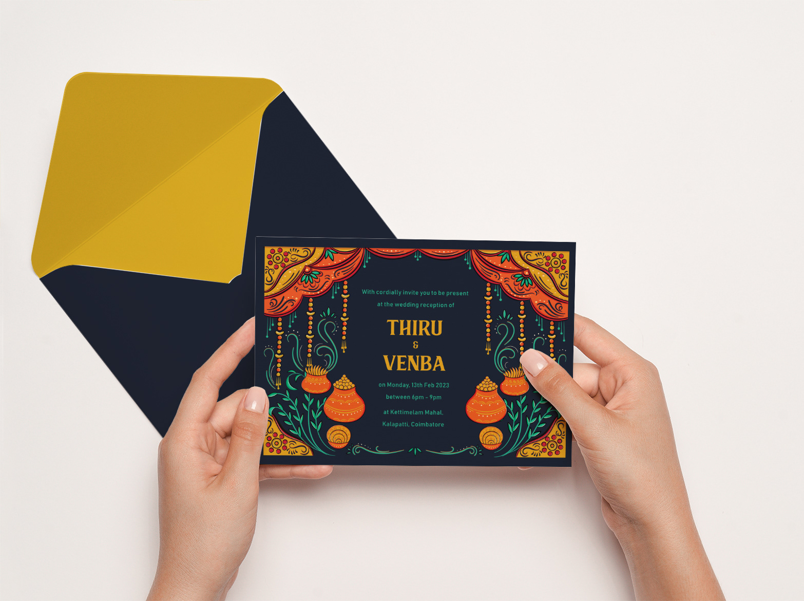 Kalyana Samayal Saadham South Indian wedding feast invitation: hands holding the invitation back with a gold envelope