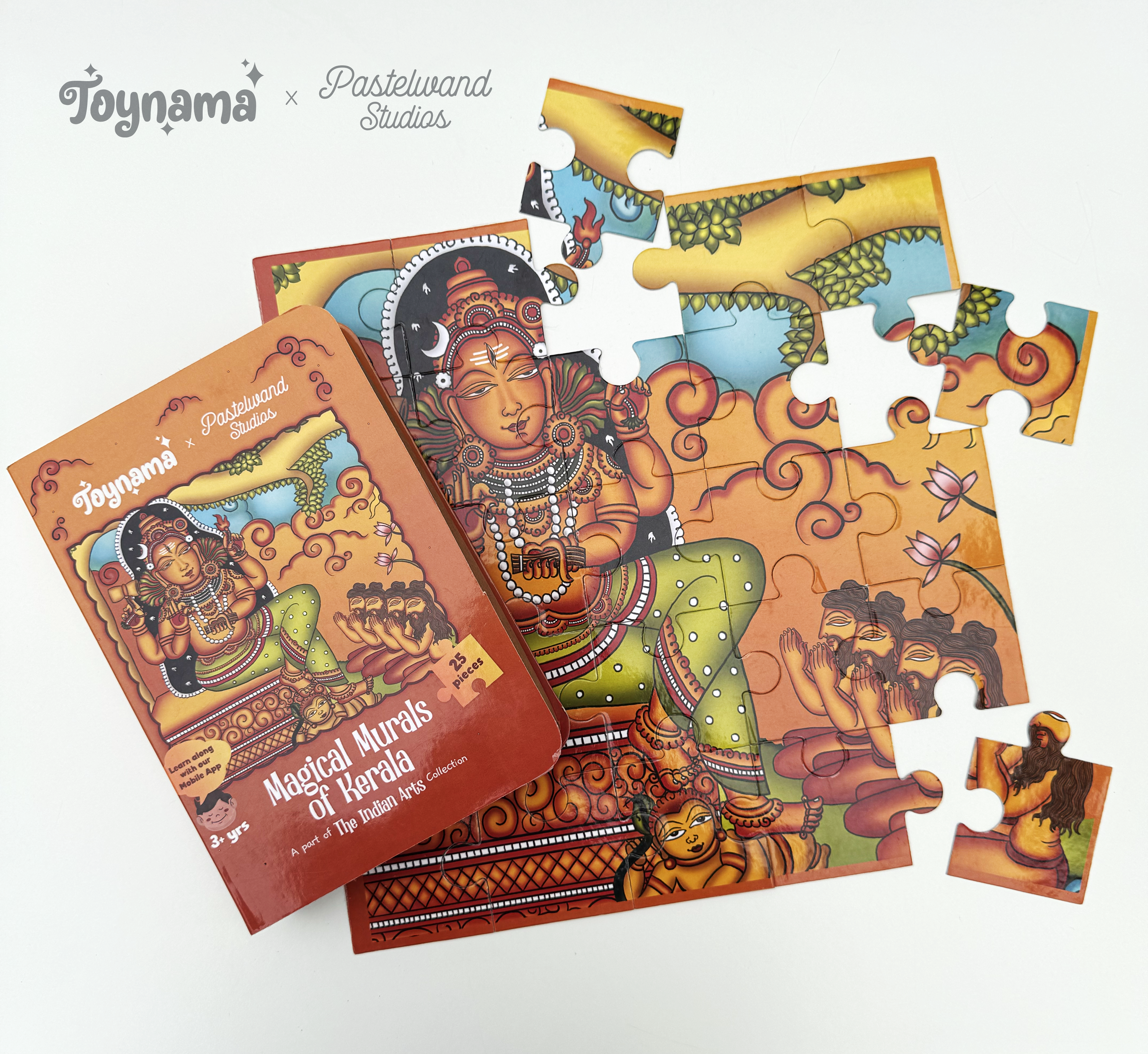 Arts of India jigsaw puzzles for Toynami: Kerala Mural jigsaw puzzle box with scattered pieces