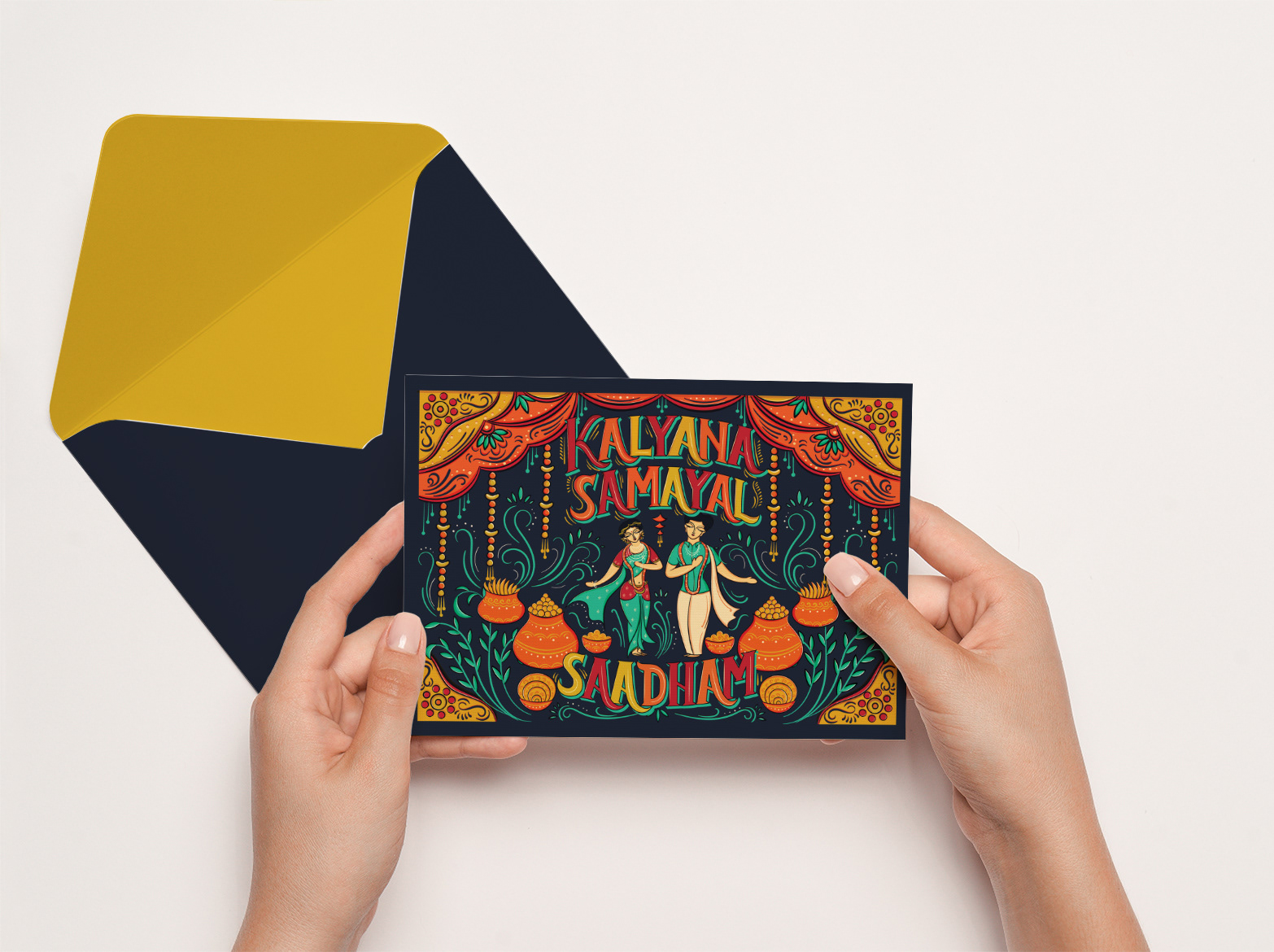 Kalyana Samayal Saadham South Indian wedding feast invitation: hands holding the printed invitation front with a gold envelope