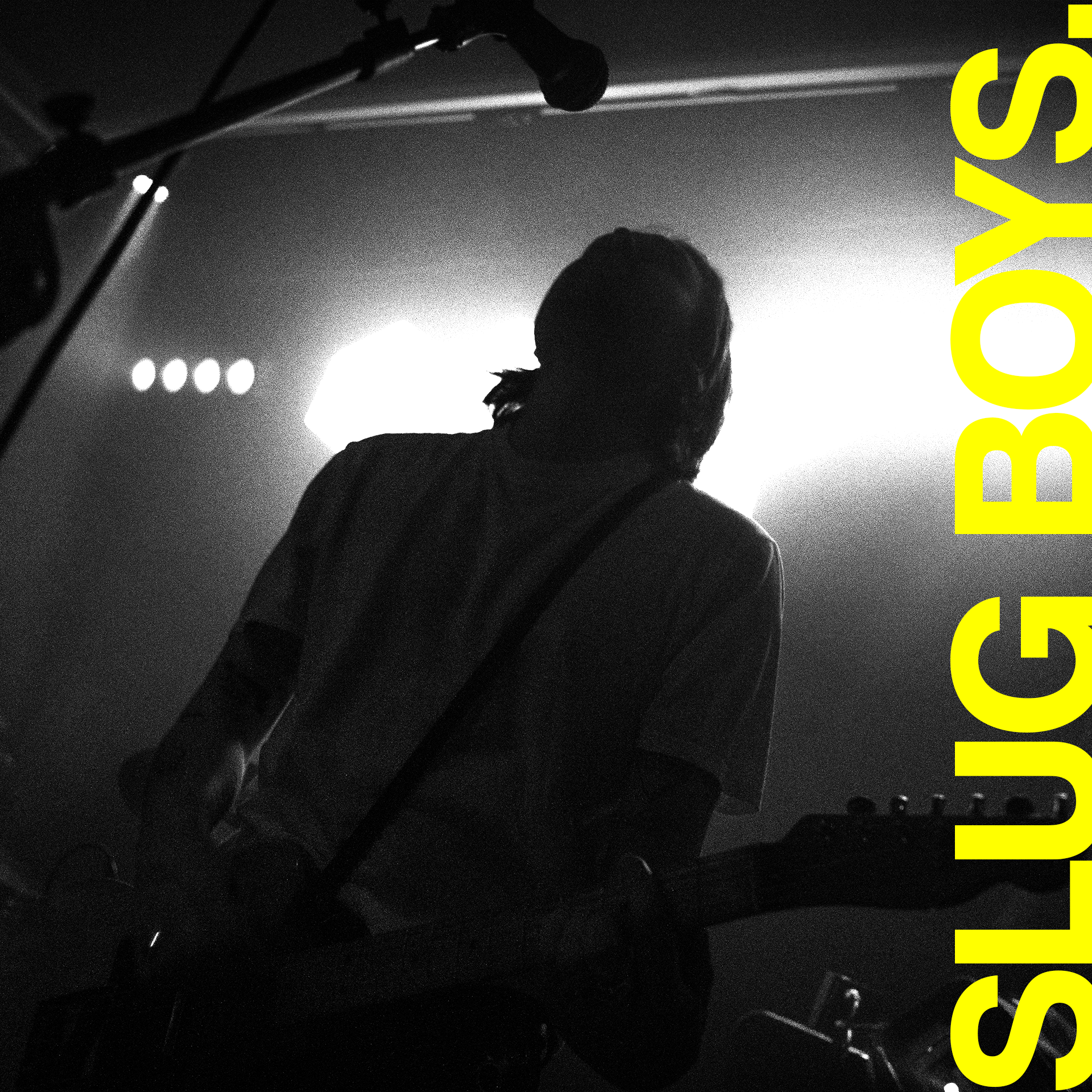 Low-angle shot of Slugboys under strobe lights and noise