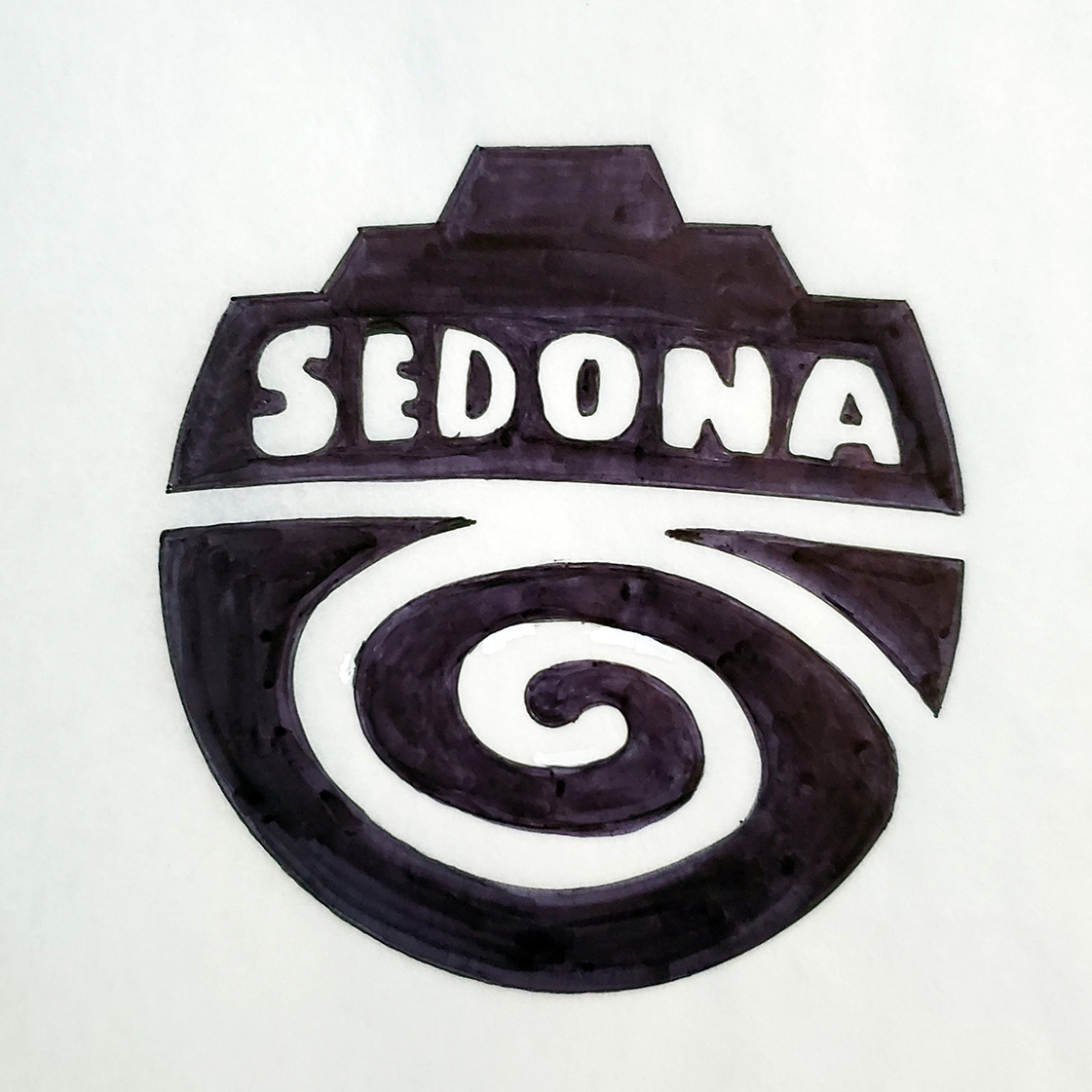 This concept combines Sedona's red rock formations with a spiral motif that can be found in nearby petroglyphs and traditional textile patterns. The spiral can also represent the energy vortexes said to be common in Sedona, and a winding path such as a spiral labyrinth. The lettering is bold but plain to represent both the weight of rock and simple, iconic petroglyph symbols.