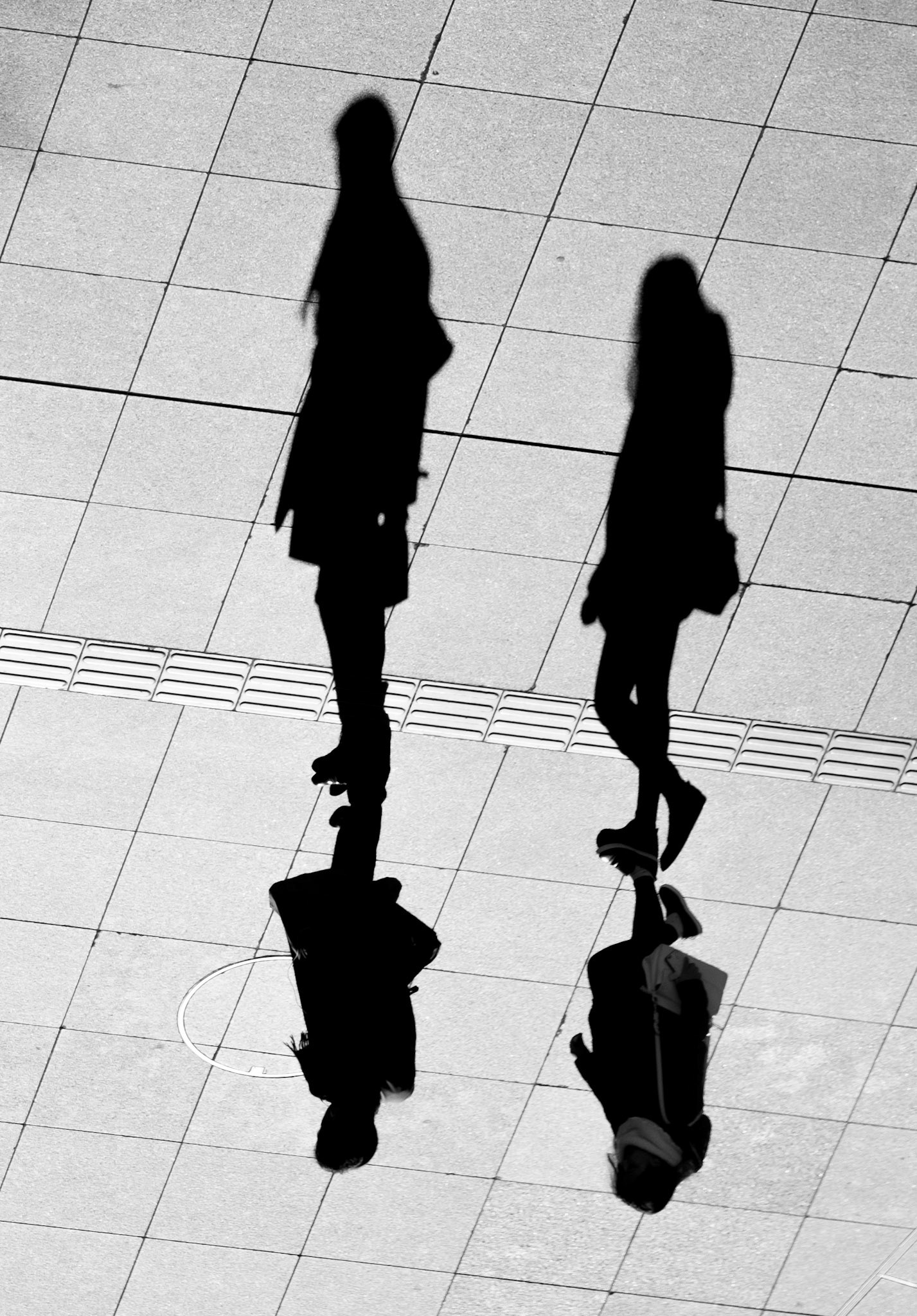 Upside down abstract photo of people walking through Shinjuku