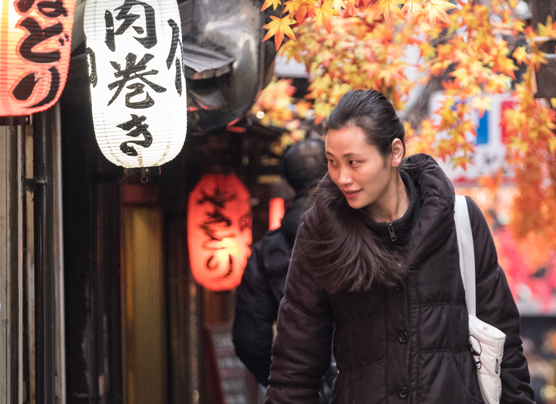Woman in Piss Alley, aka Omoide Yokocho and Shomben Yokocho, in Shinjuky Tokyo