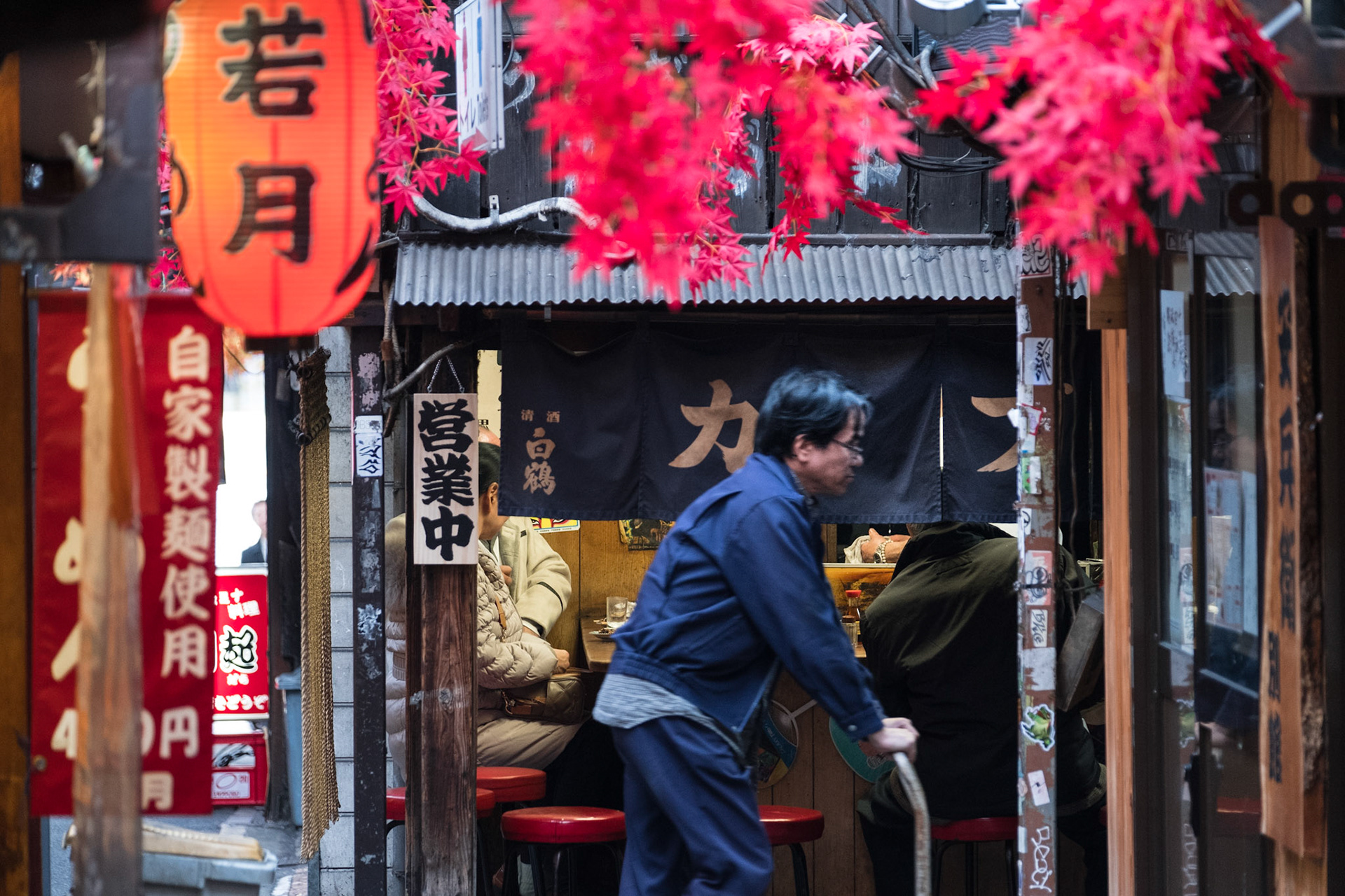 Delivery man bringing beer to the bars in Piss Alley, aka Omoide Yokocho and Shomben Yokocho, in Shinjuky Tokyo