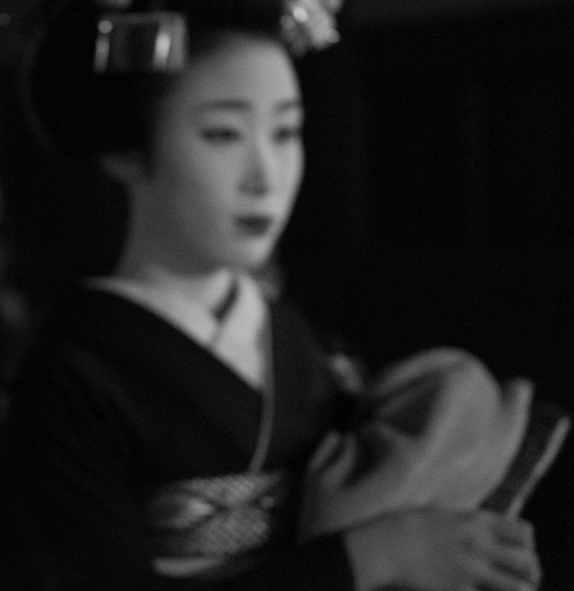 Geisha walking through the Gion district in Kyoto.