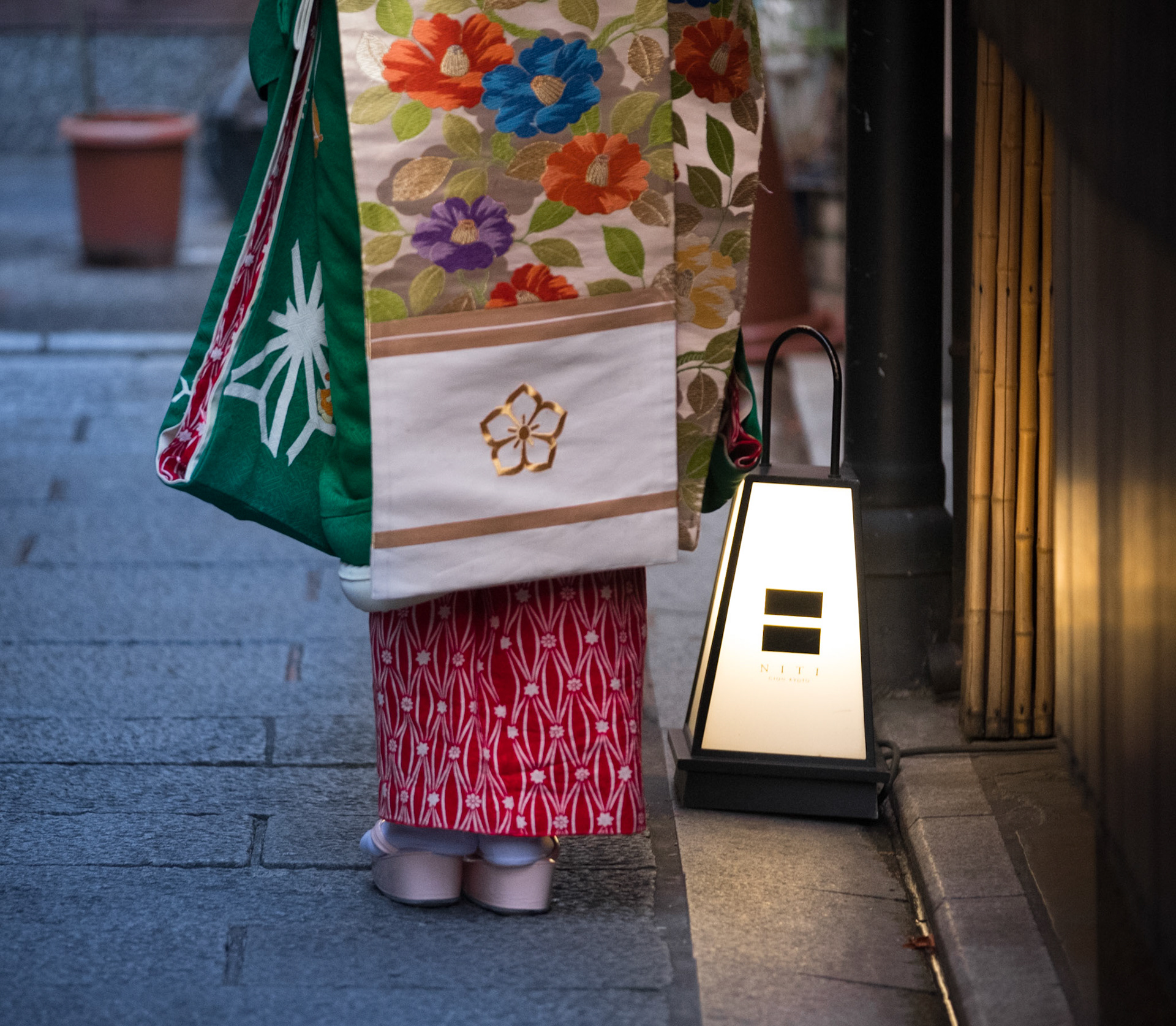 Maiko Geisha walking through the Gion district, going to tea ceremonies.