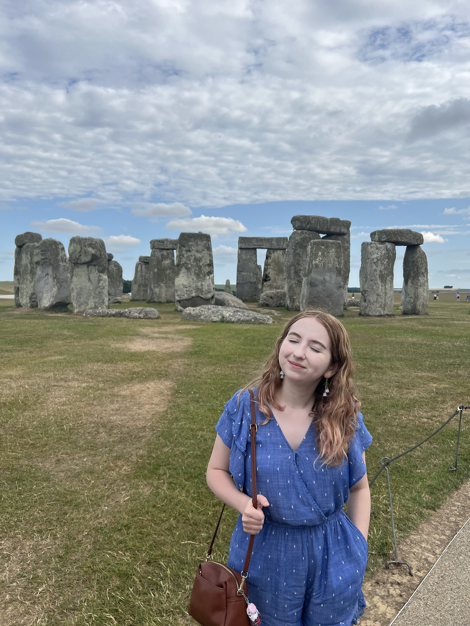 I love spending time outdoors and traveling. Here at Stonehenge, I'm soaking up the sun.
