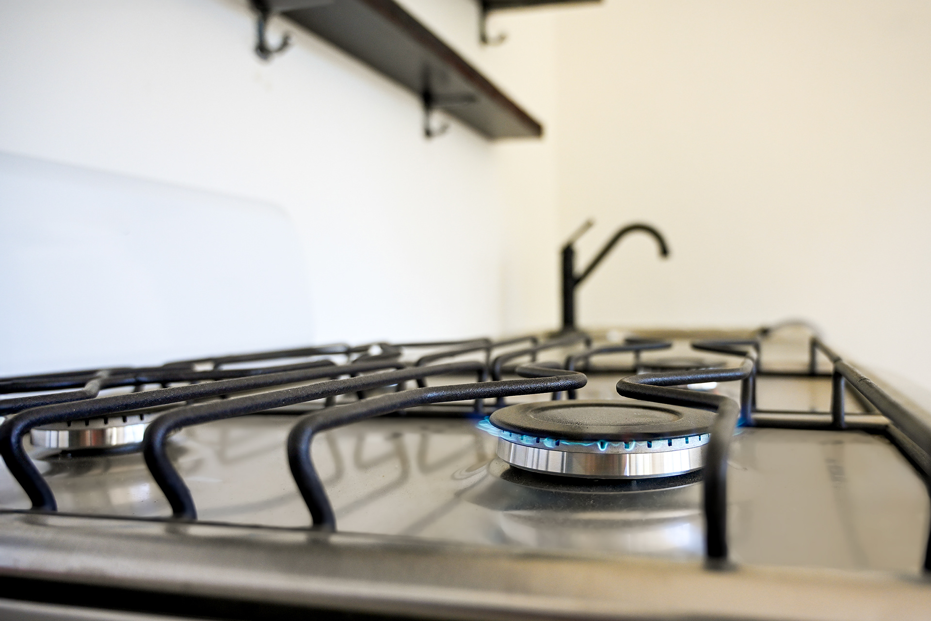 The newly installed gas stove in the master suite kitchen at Hacienda Eterna Primavera is ready for use. A perfect blend of functionality and rustic charm, this hacienda-style kitchen invites guests to cook delicious meals or simply prepare a fresh coffee while enjoying their vacation stay in a serene Airbnb retreat.