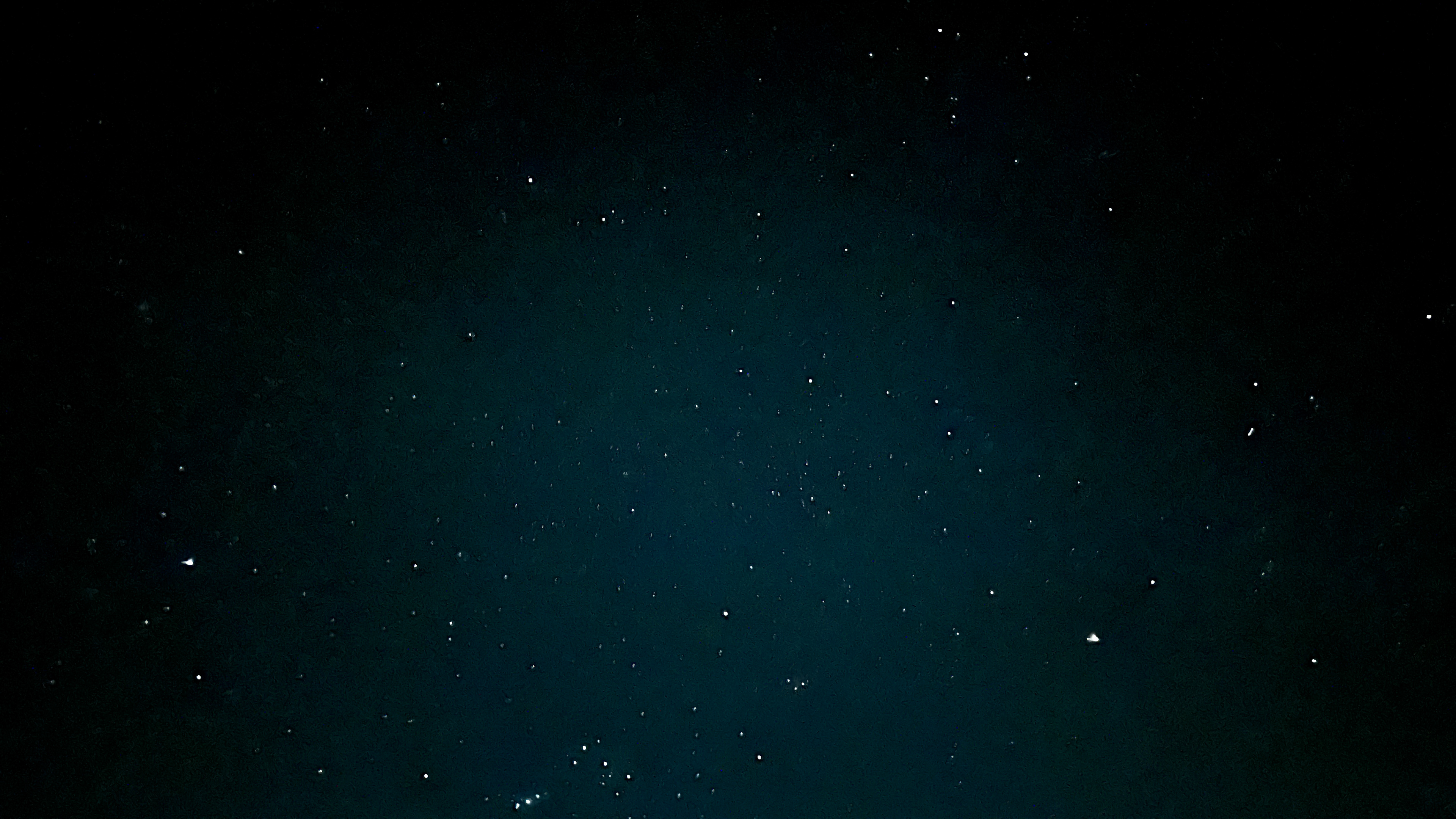 Star-filled night sky above the tropical mountains in Puerto Rico, viewed from the garden of Hacienda Eterna Primavera.