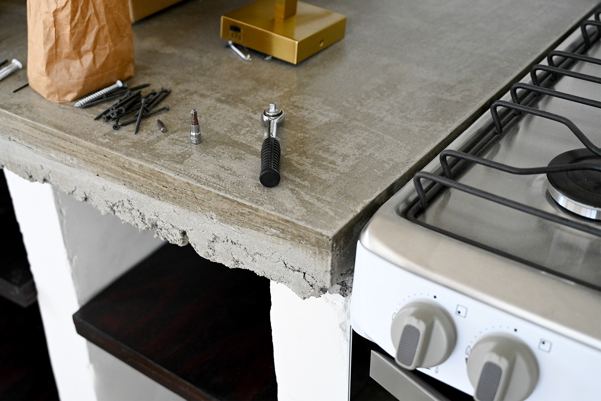 Smooth concrete countertop in the kitchen of Hacienda Eterna Primavera, showing a rustic and natural material choice for a tropical Airbnb design.