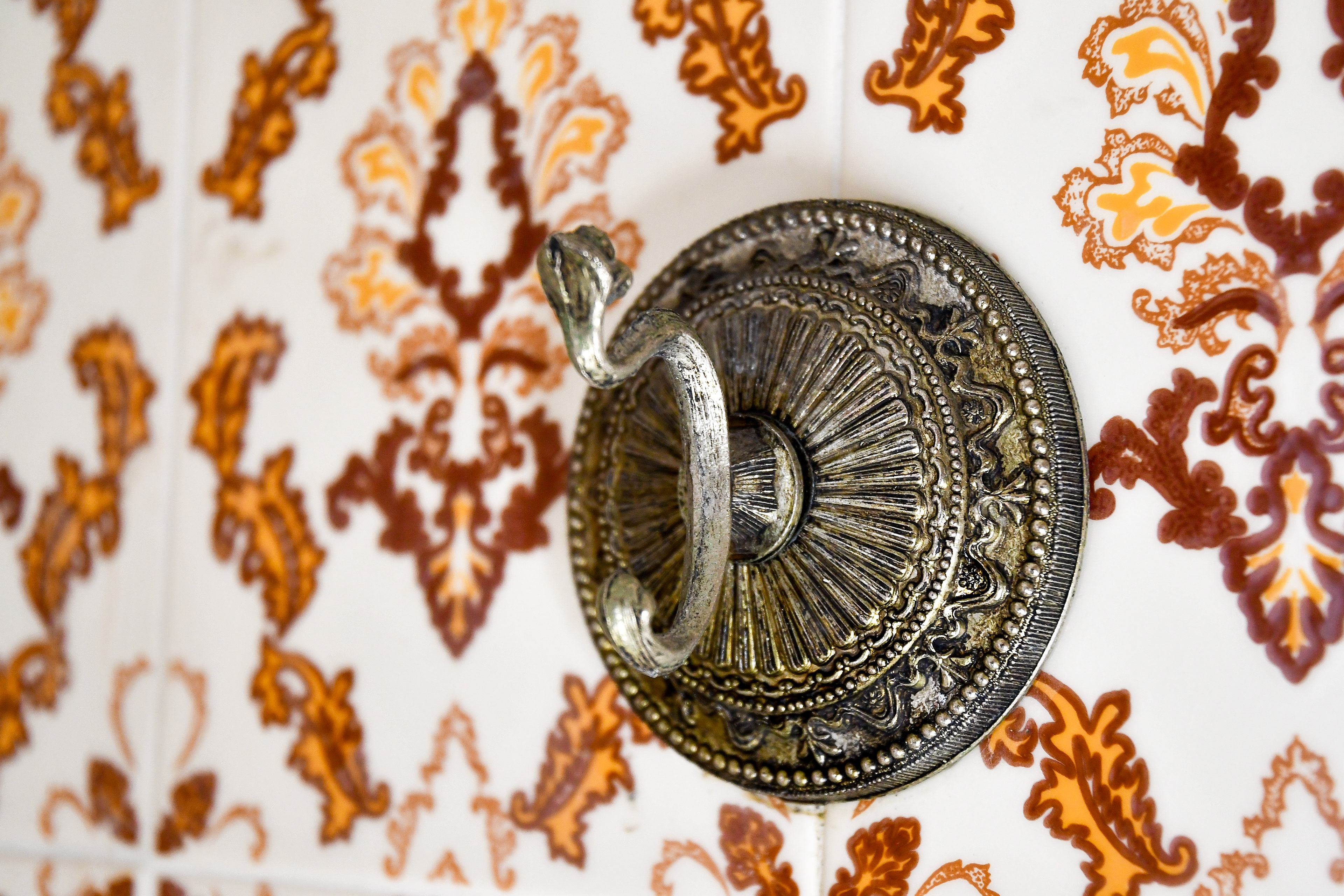 A close-up of a restored bathrobe hook in the master suite bathroom of Hacienda Eterna Primavera, maintaining the hacienda’s historic charm.