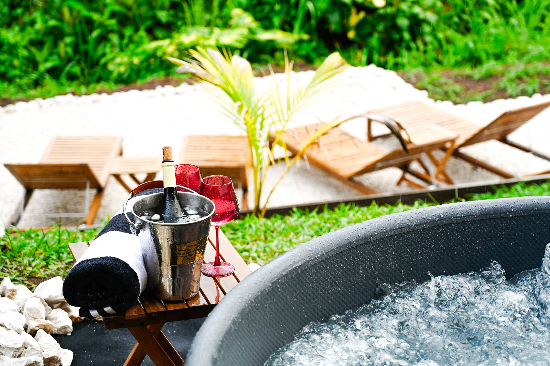 Private Jacuzzi with chilled champagne and tropical garden views at Hacienda Eterna Primavera in Puerto Rico.