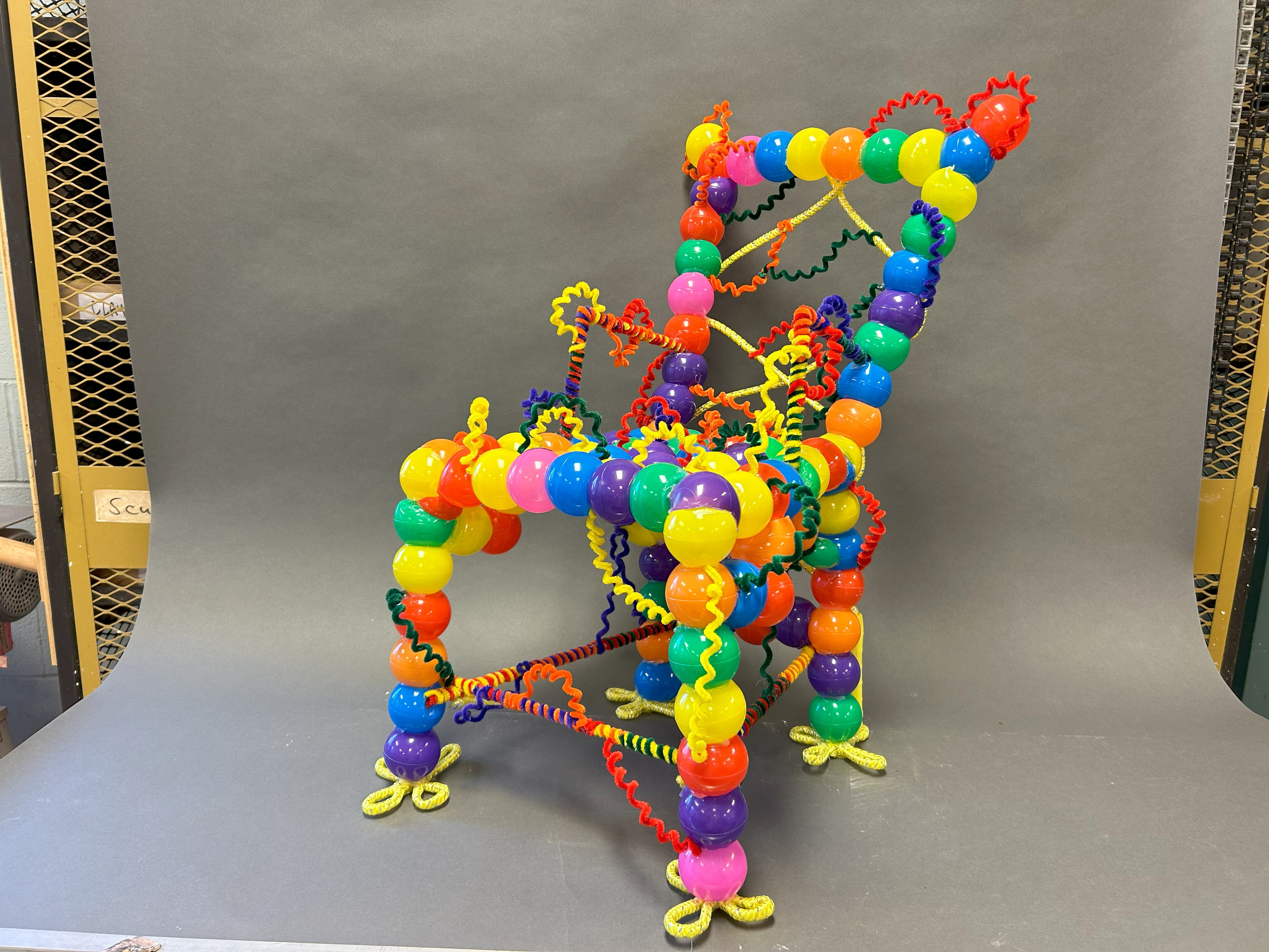 "Clown Chair" Plastic Balls, Pipe Cleaners, Wooden Dowels, 2023