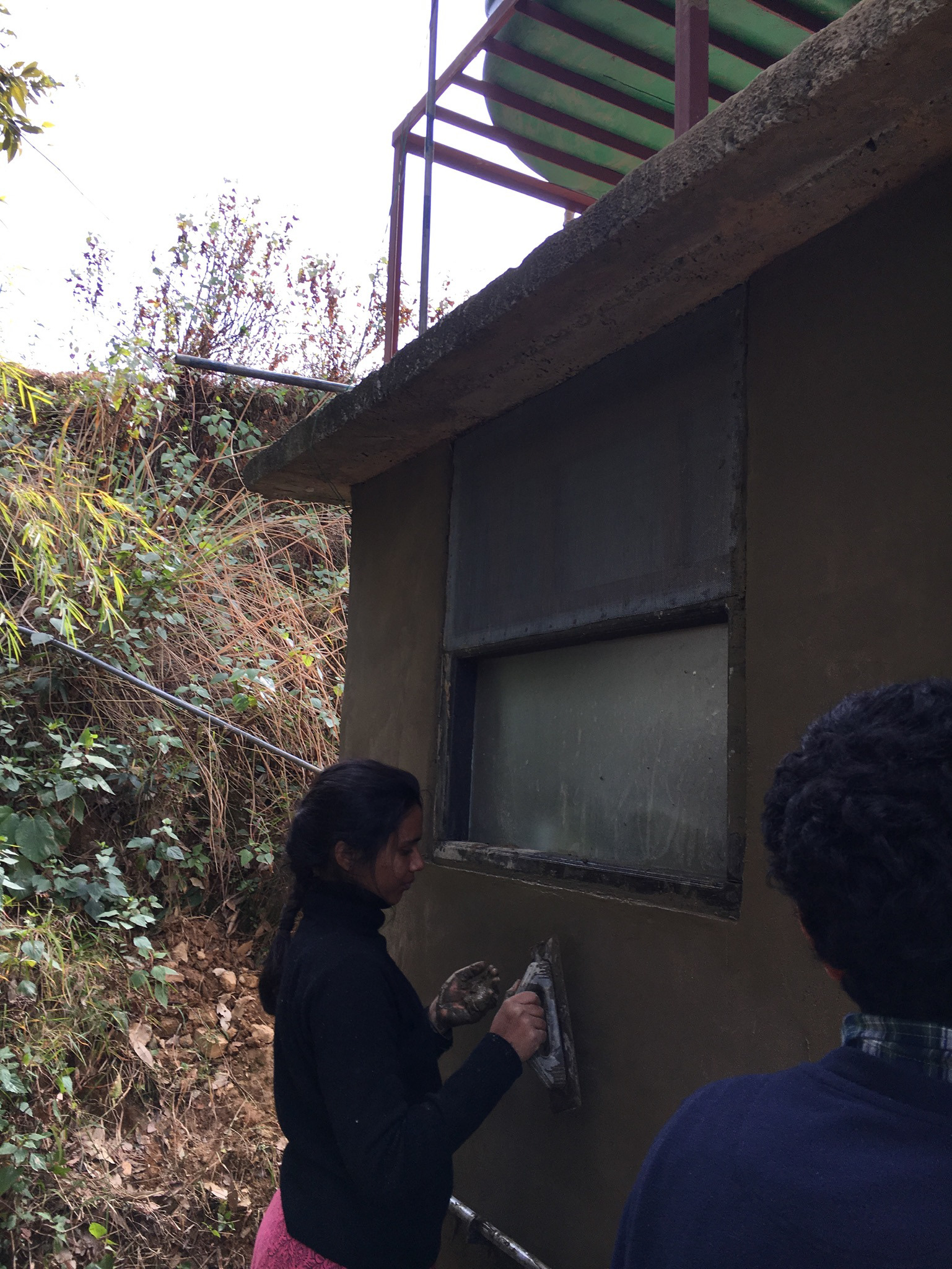 Plastering three layers of cowdung