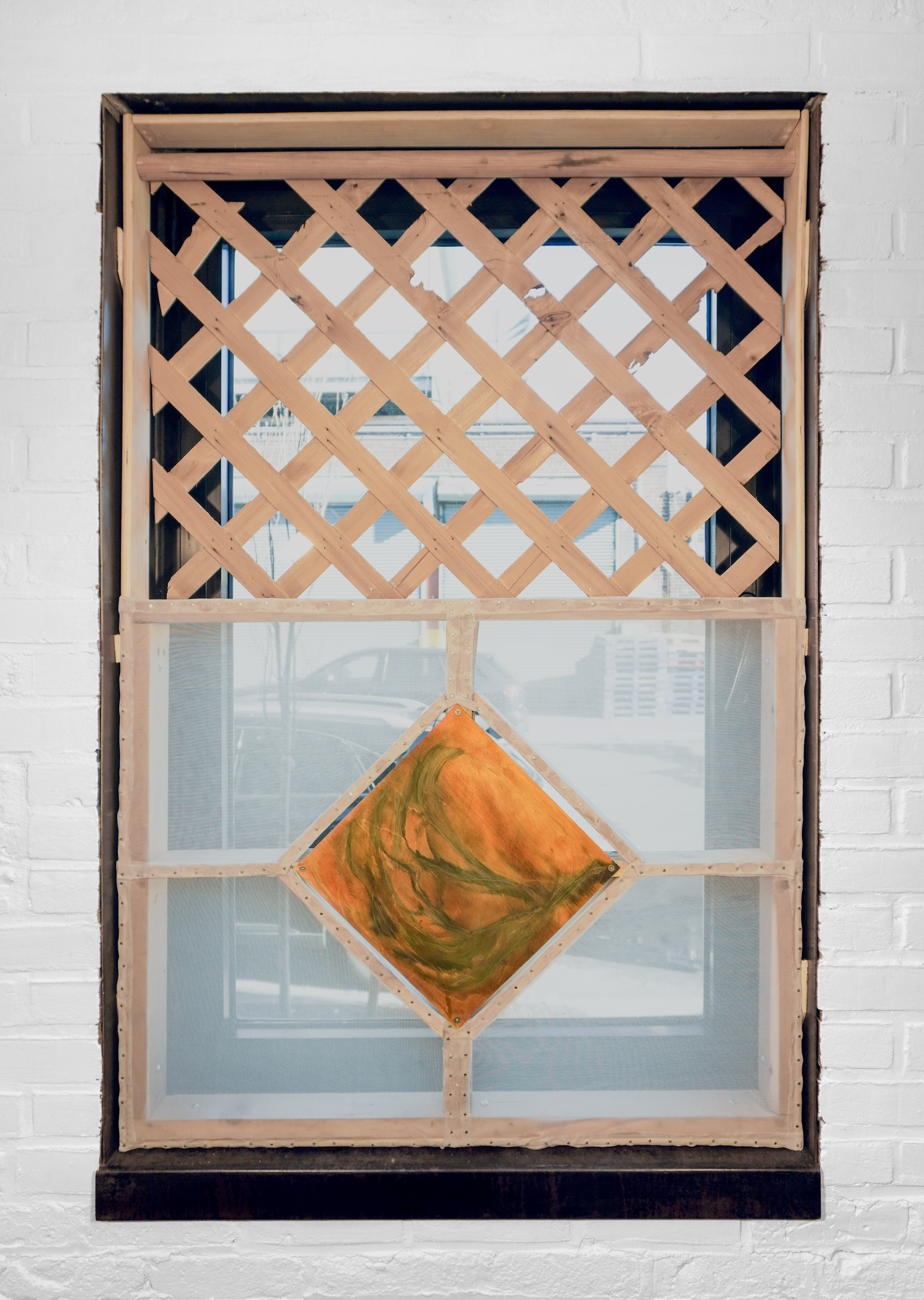 Meinzer and Victoria Reshetnikov Hush Lobby, 2026  Wood cutoffs from 37th Avenue, Grand Street, and 48th Street. Lattice from Facebook Marketplace. Slats from 3 bedframes. Deconstructed washing machine foundation from Middle Village. Shipping palettes from Connecticut and a new Sunnyside grocery store. 3D printed custom parts. Cords, produce netting, shoelaces, surveyor’s tape, plastic bags, braided strings. Pine. (Reshetnikov)  Canvas, tulle, fabric dye, colored pencil. (Meinzer)  4 ⅛’ X 11 ½’ (The approximate size of an average New York City balcony). (Wall Form) 2 ⅞’ x 4 ⅜’ (A quarter inch shorter in width and height of the gallery’s windows). (Window Forms)