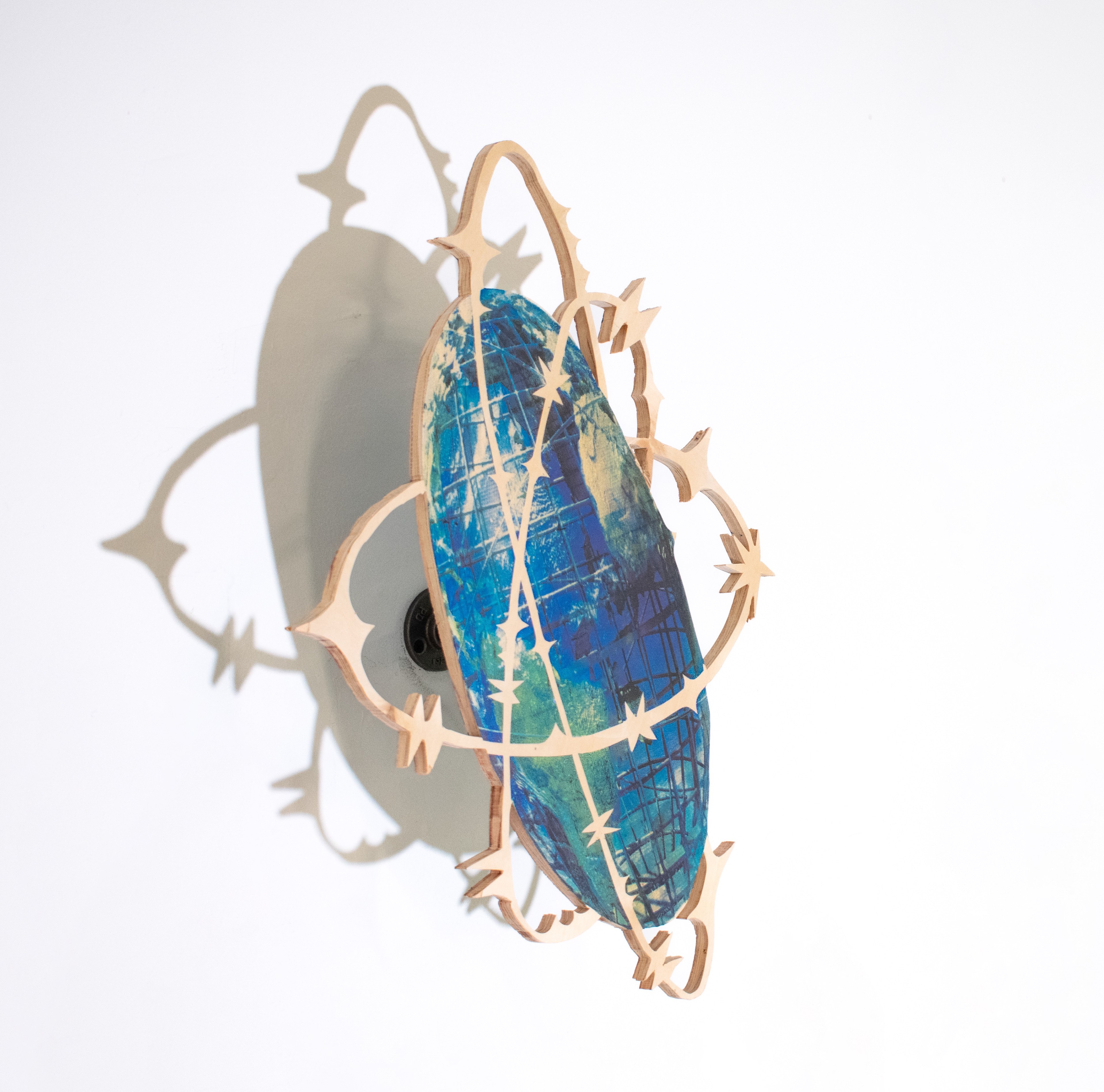 the world has always been yours (after Unisphere), 2024, Screenprint on wood, hardware, 12 x 20"