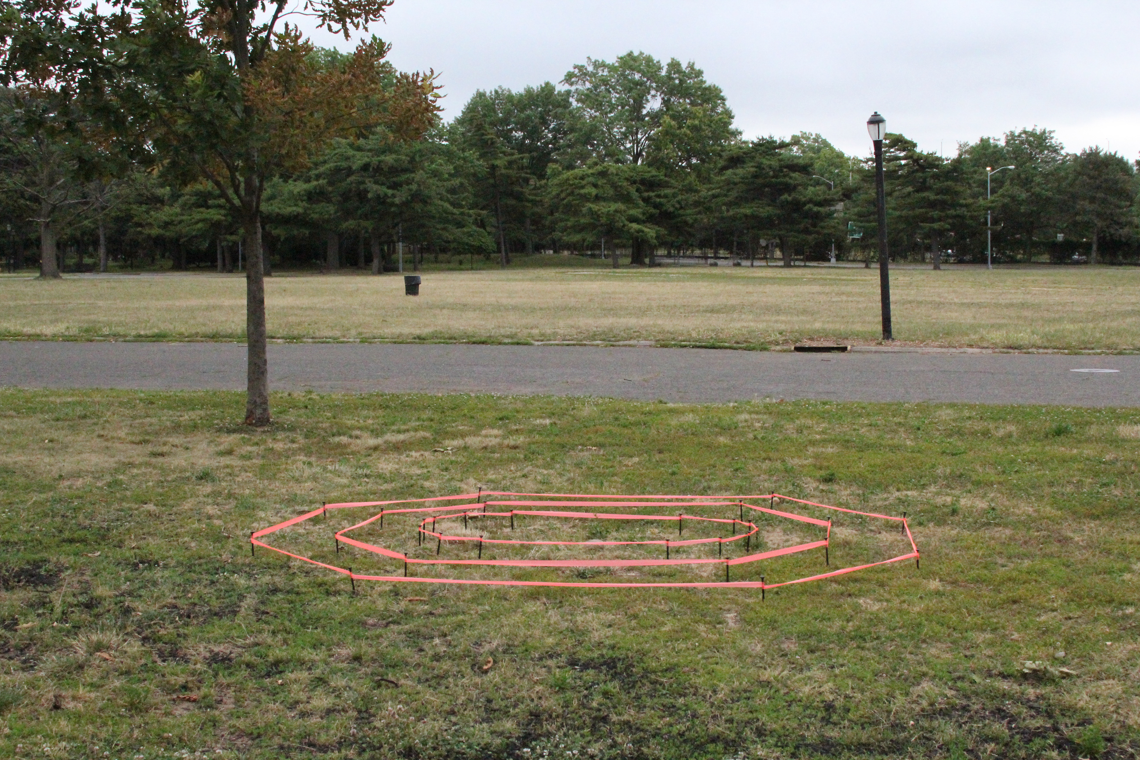 Mappings: The Pieta in The Vatican Pavilion, 2023, plastic stakes and survey tape, 10' x 8'​​​​​​​