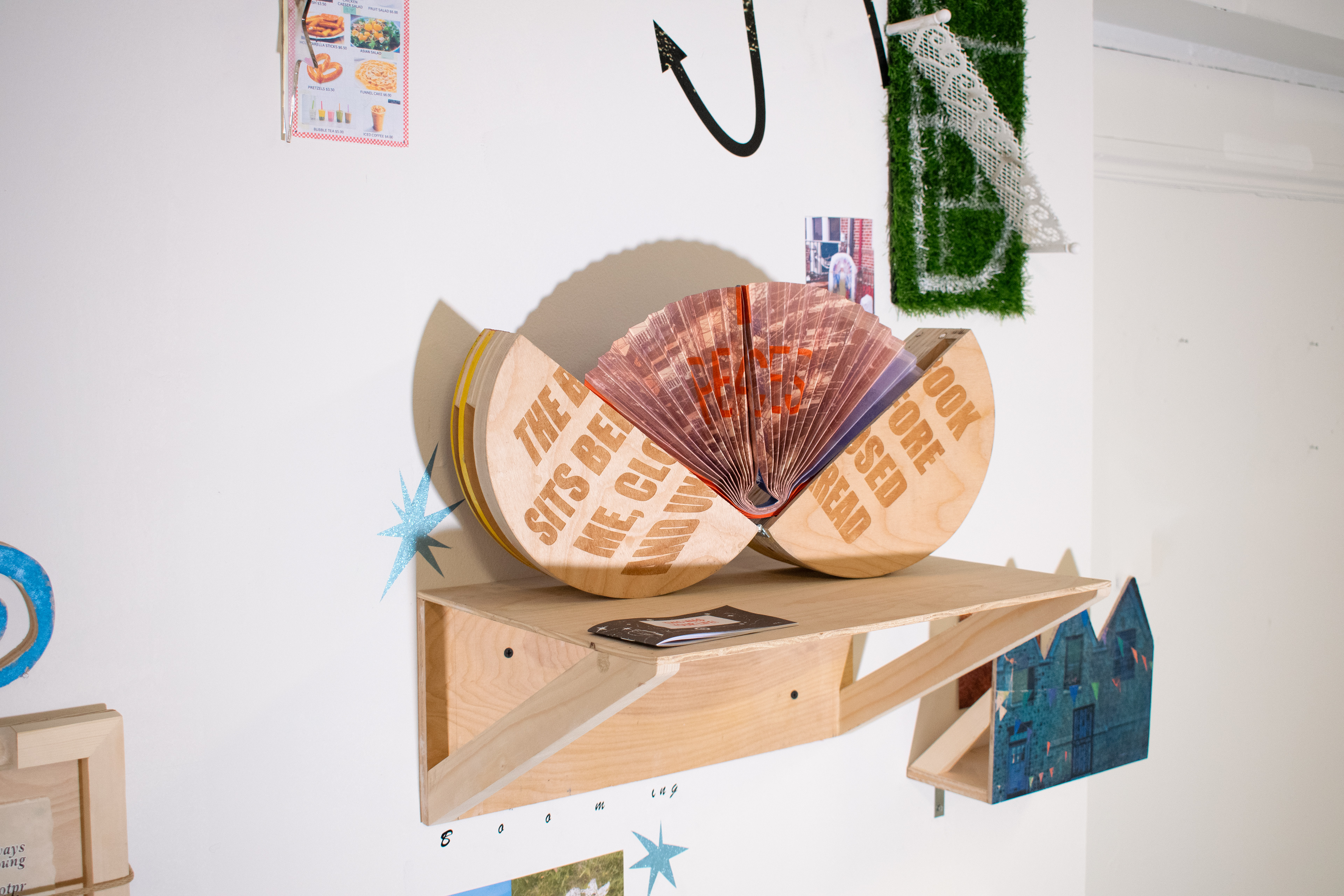 New York State Pavilion: The Book Sits Before Me, 2024, Screenprint and lasercut on wood, hardware (Exterior) Dye sublimation and screen print on Canton (Interior), 10" x 10" (Closed)