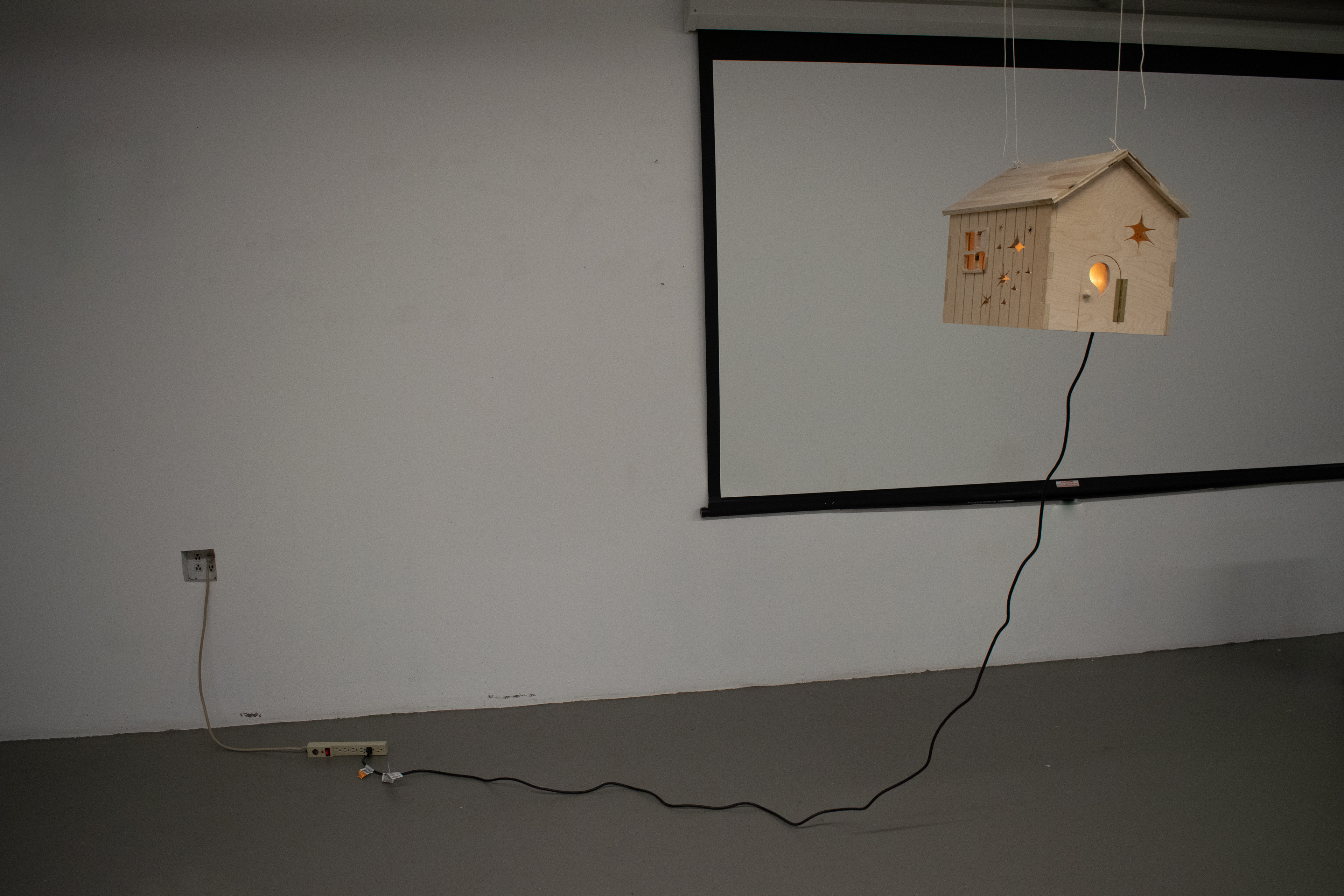Lamp House, 2023, Plywood, found nightlight, extension cord, 8" x 10" x 14"
