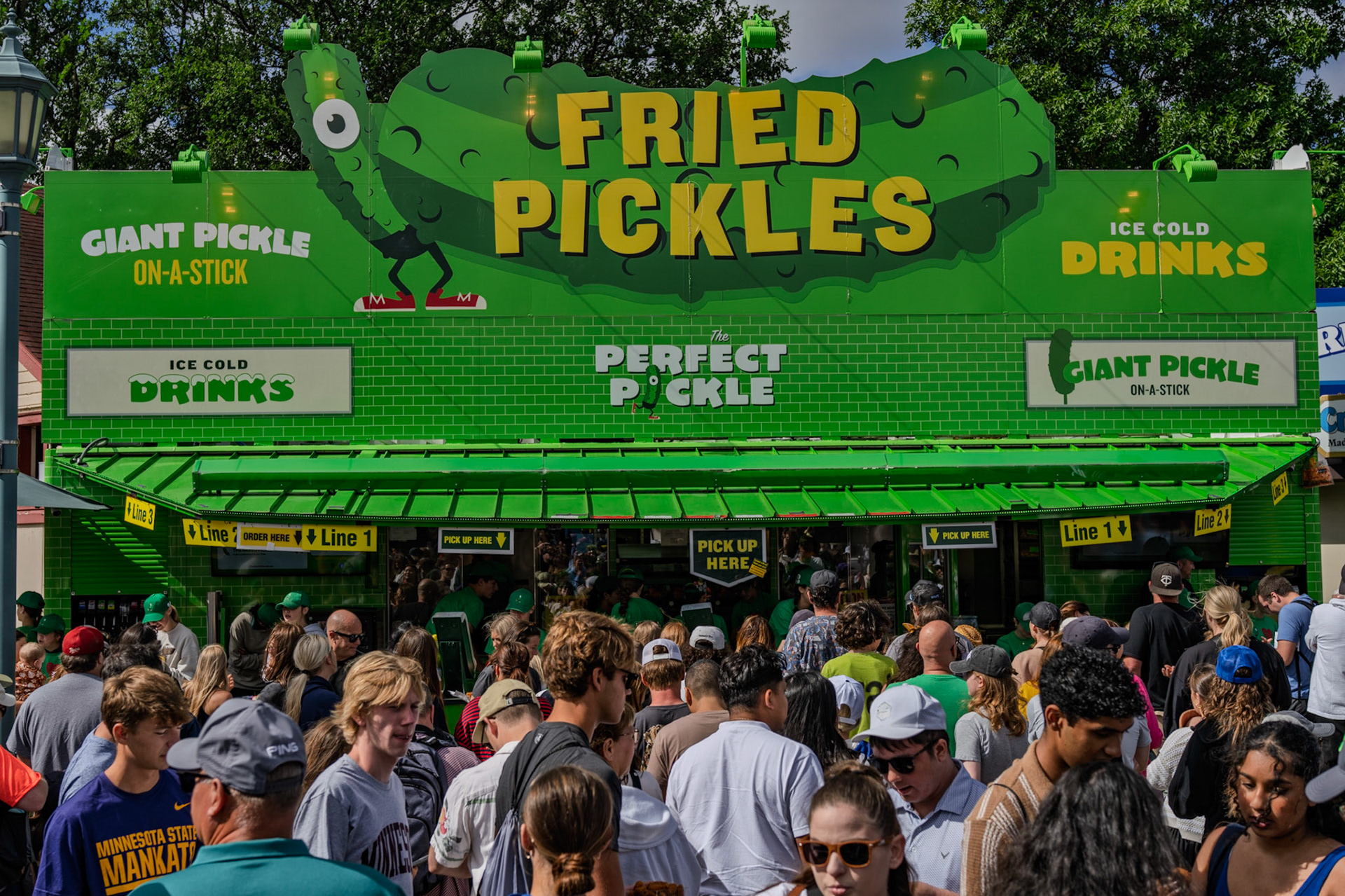 Lines for fried pickles and giant pickle on-a-stick at the Minnesota State Fair