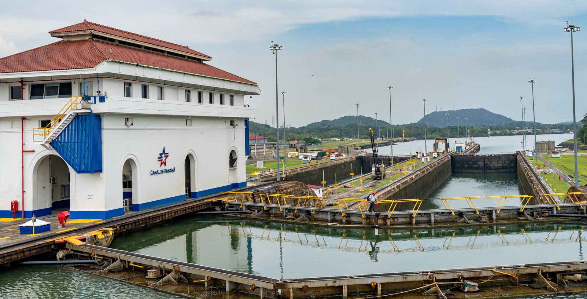 A worker crosses the west Miraflores Locks