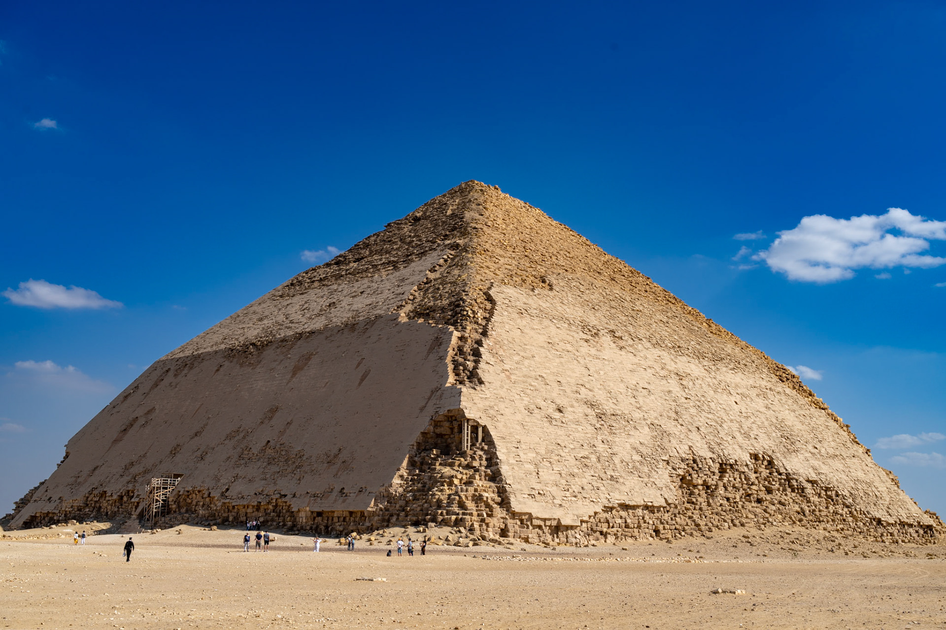 Bent pyramid by Sneferu. 54-degree for 47 meters, then 43 degrees to the top