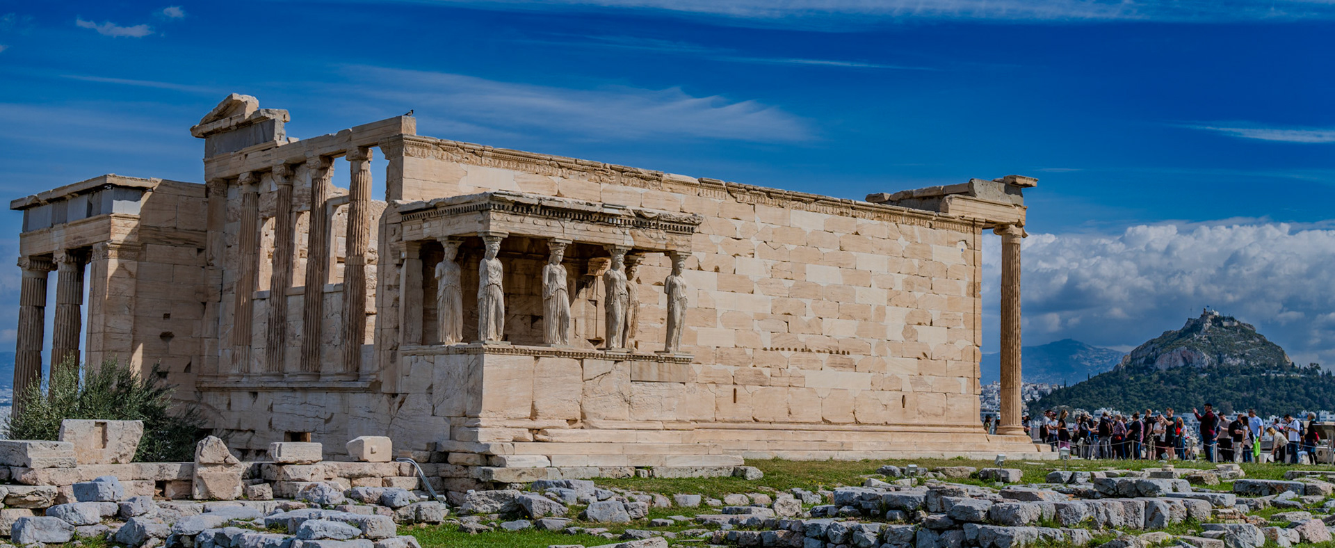 Porch of the Maidens on the southwest side of the Erechtheum. Mount Hymettus visible in background