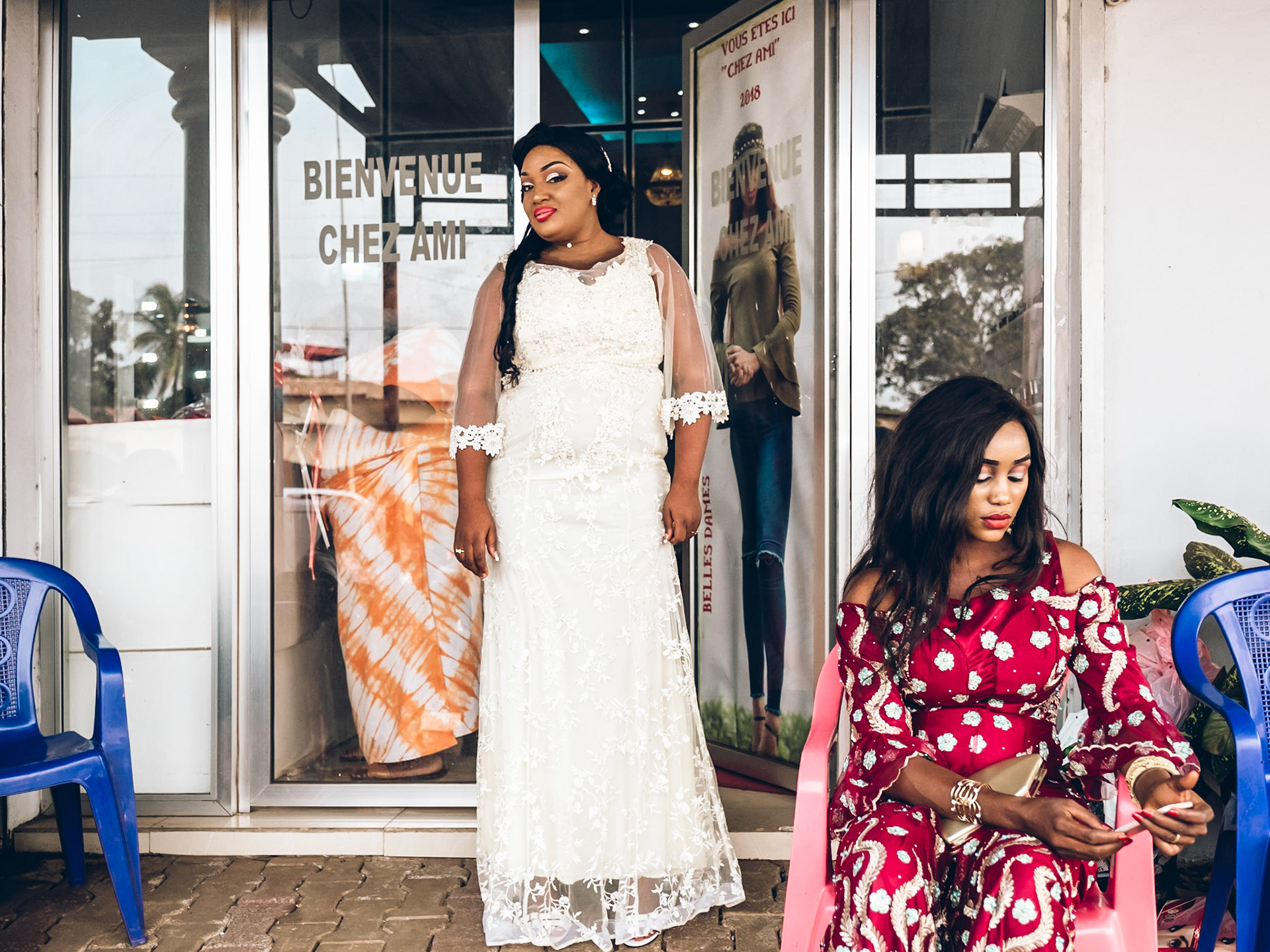 Marly is ready to leave for her wedding after setting her hair at the beauty salon. Conakry, Guinea.