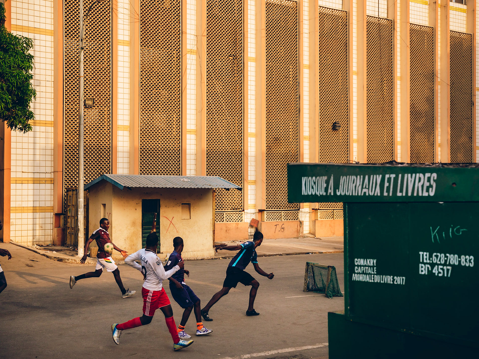 Saturday evening football in Kaloum district. Conakry, Guinea.