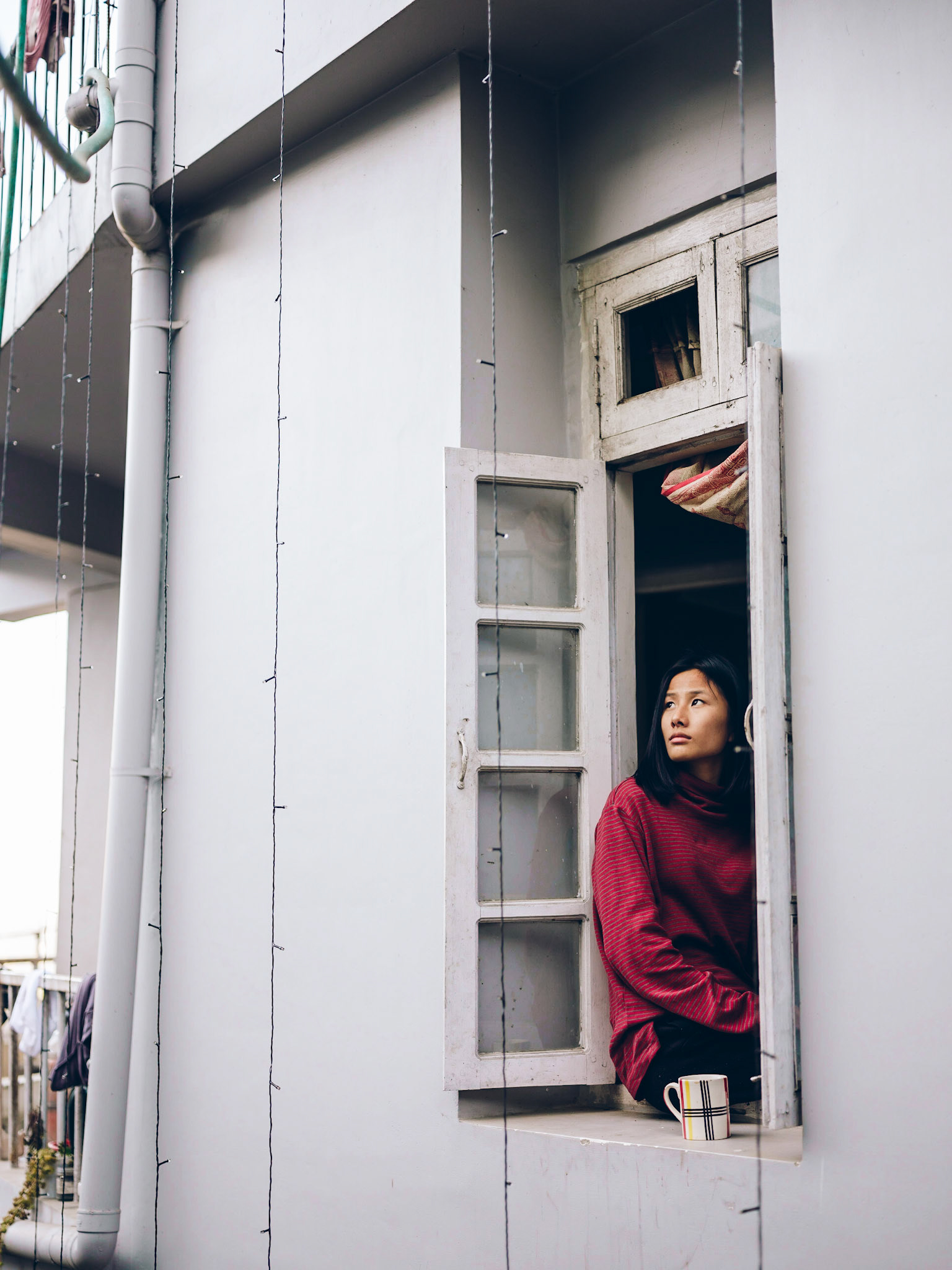 From D cafe above her building, I saw her down below sitting by the window and sipping tea. I had to make a portrait of her, the first one of this trip. Peter and I went through the maze of Kohima's streets to find her. She obliged shyly.