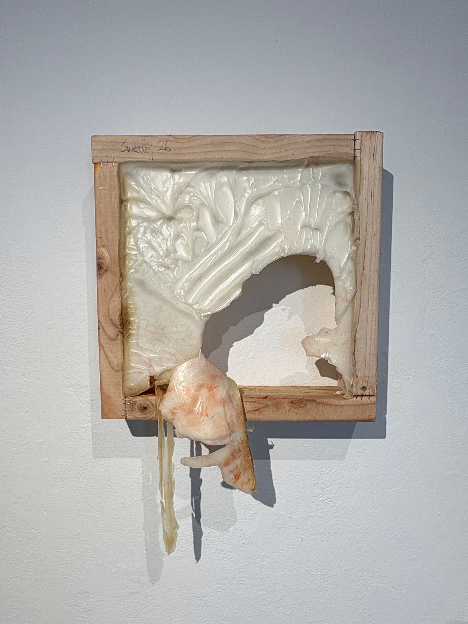 Shawn Sweeney, Hole., 2026. Wall-mounted sculptural relief made from matte gel, staples, and lumber with rust patina, 15x15x4 inches. Failed bronze casting from 4 World Trade Center Studios.