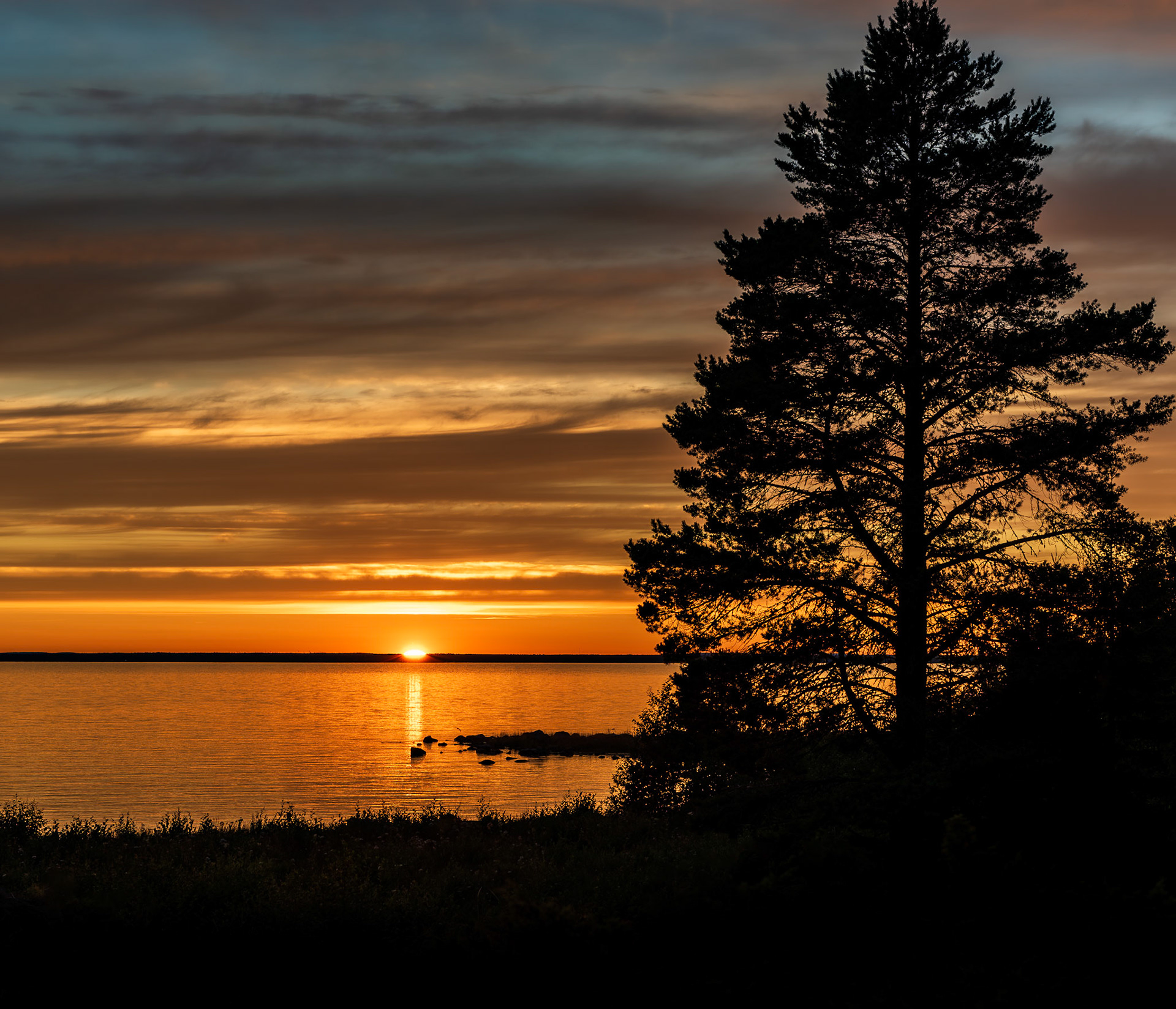 Sunset photo. Swedish island Holmon a warm summer evening. Sunset in the Bothnian Bay.