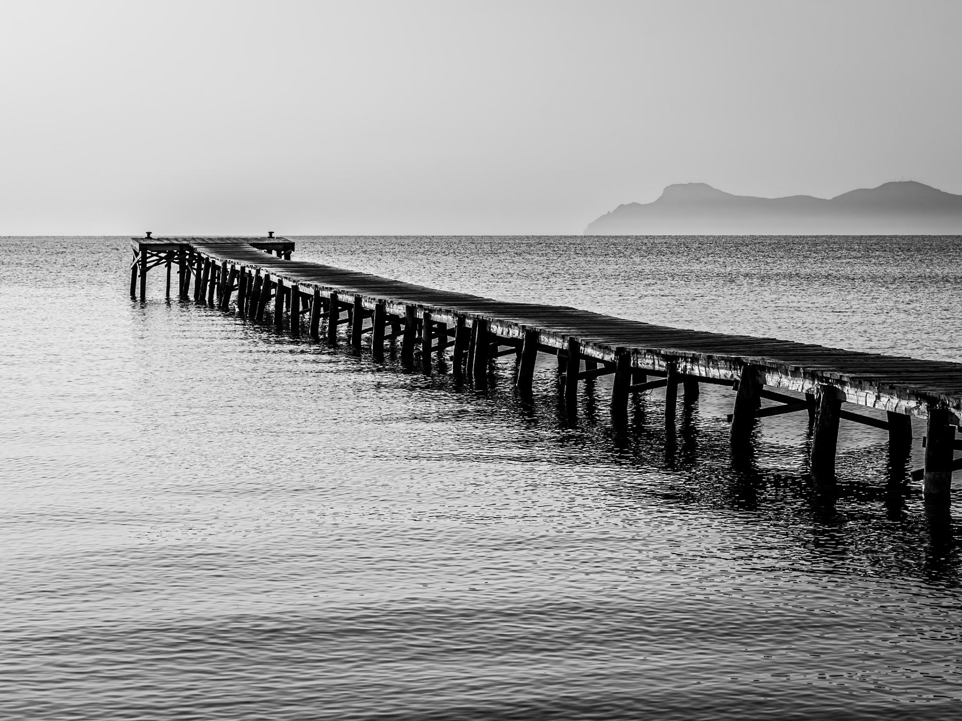 Pier in Mallorca an early morning. The photo was taken in June 2025.