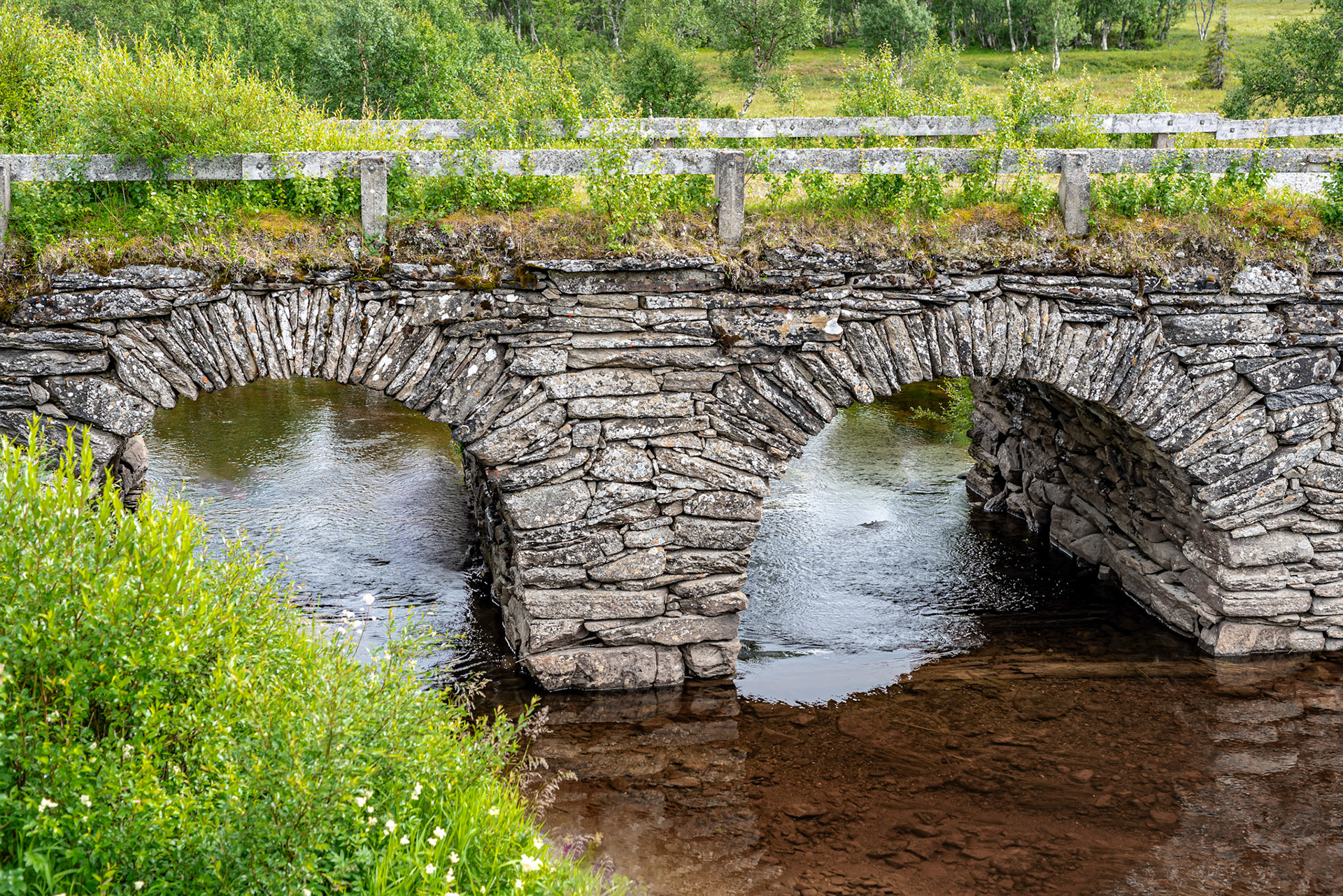 Stone arch bridge from the mid 1800's along Skalstugevägen, Sweden. Stonewalled natural stones.