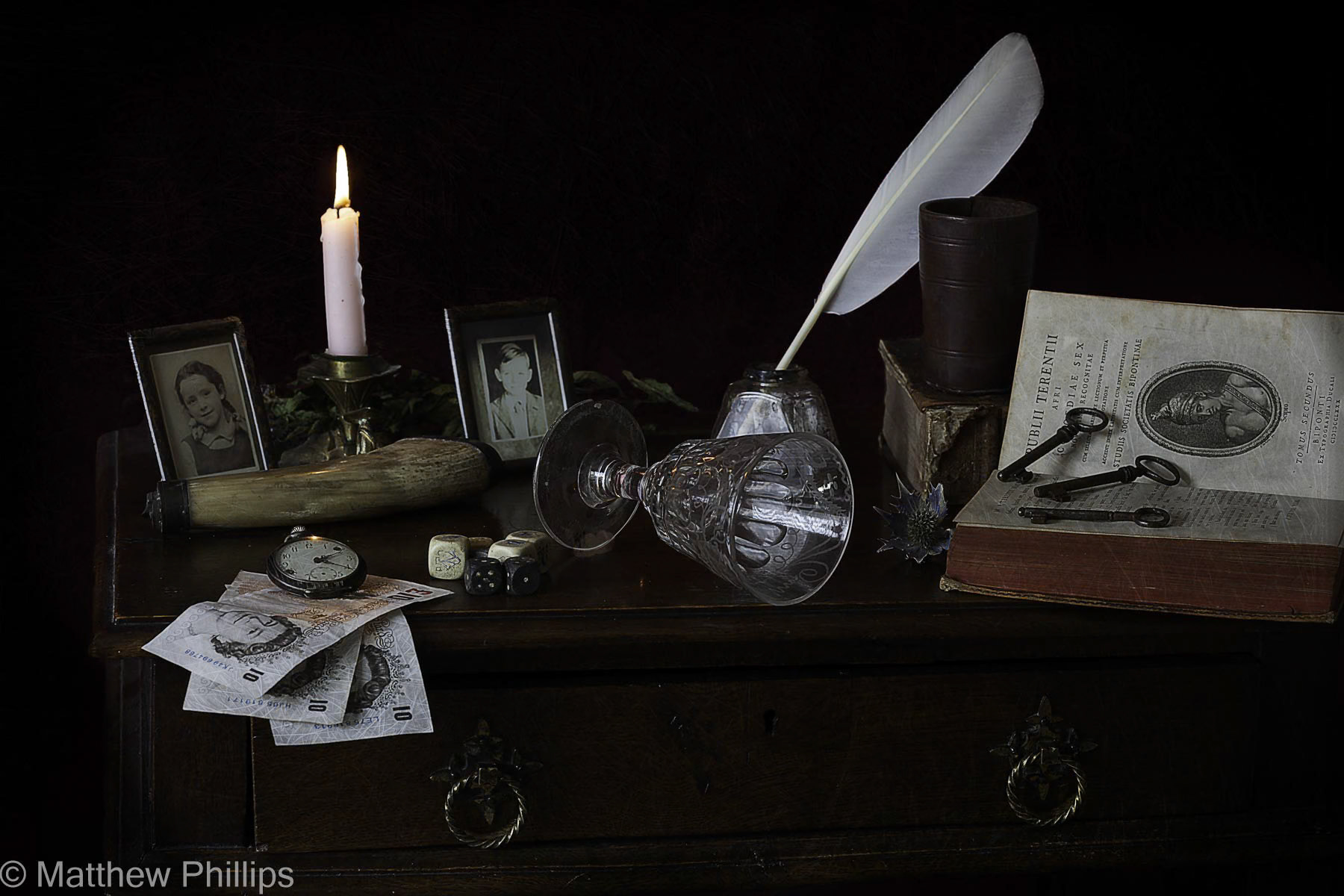 Vanitas with money and falling wine glass