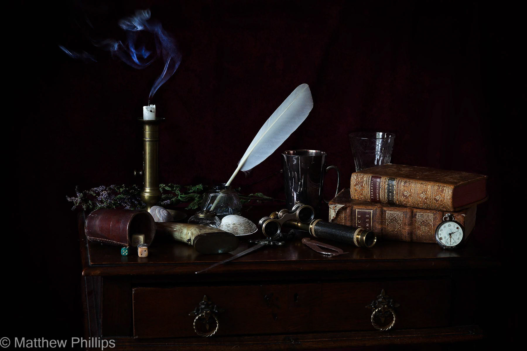 Vanitas with feather and snuffed candle