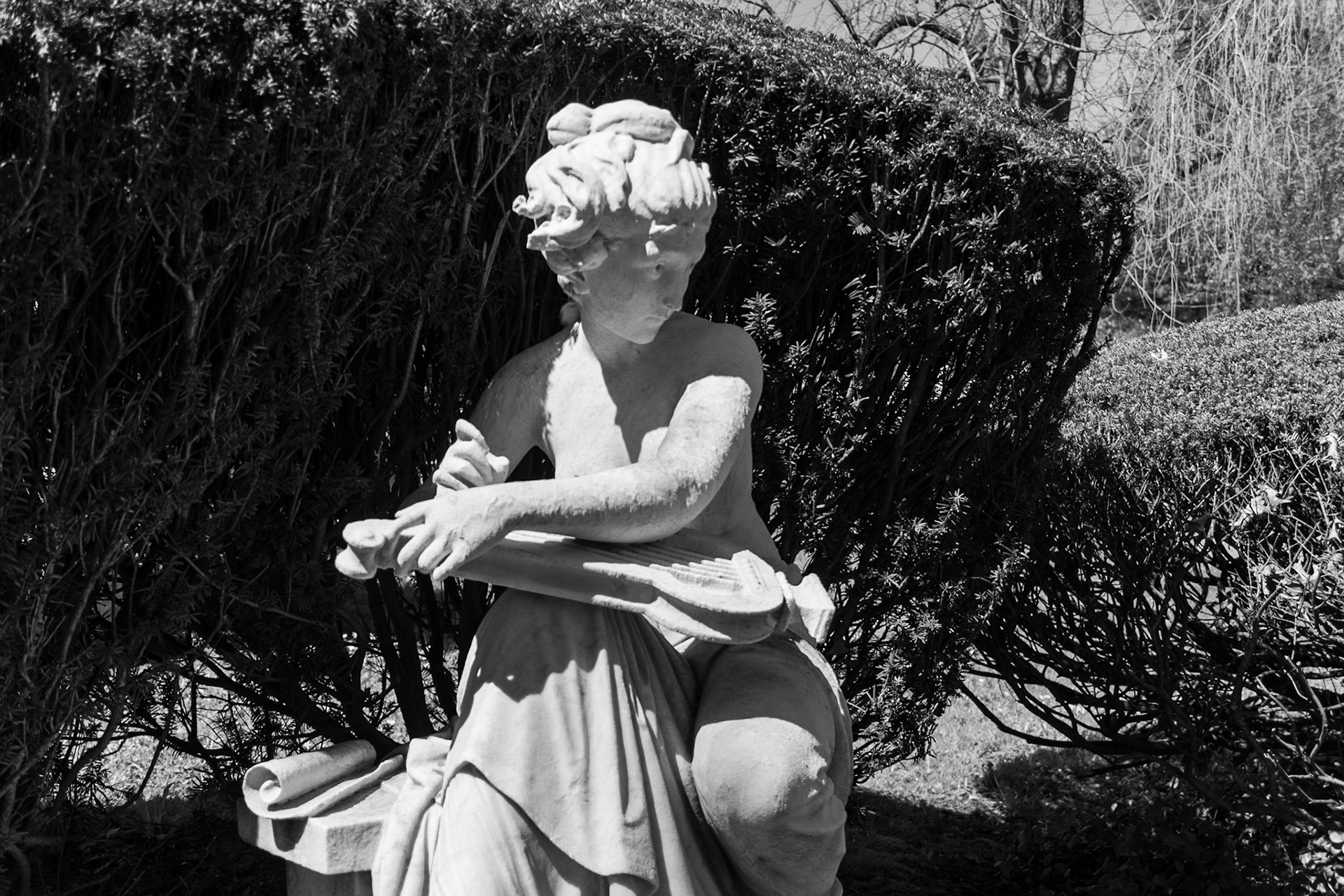 This statue depicting a woman playing the harp sits overlooking the Lexington Cemetary.