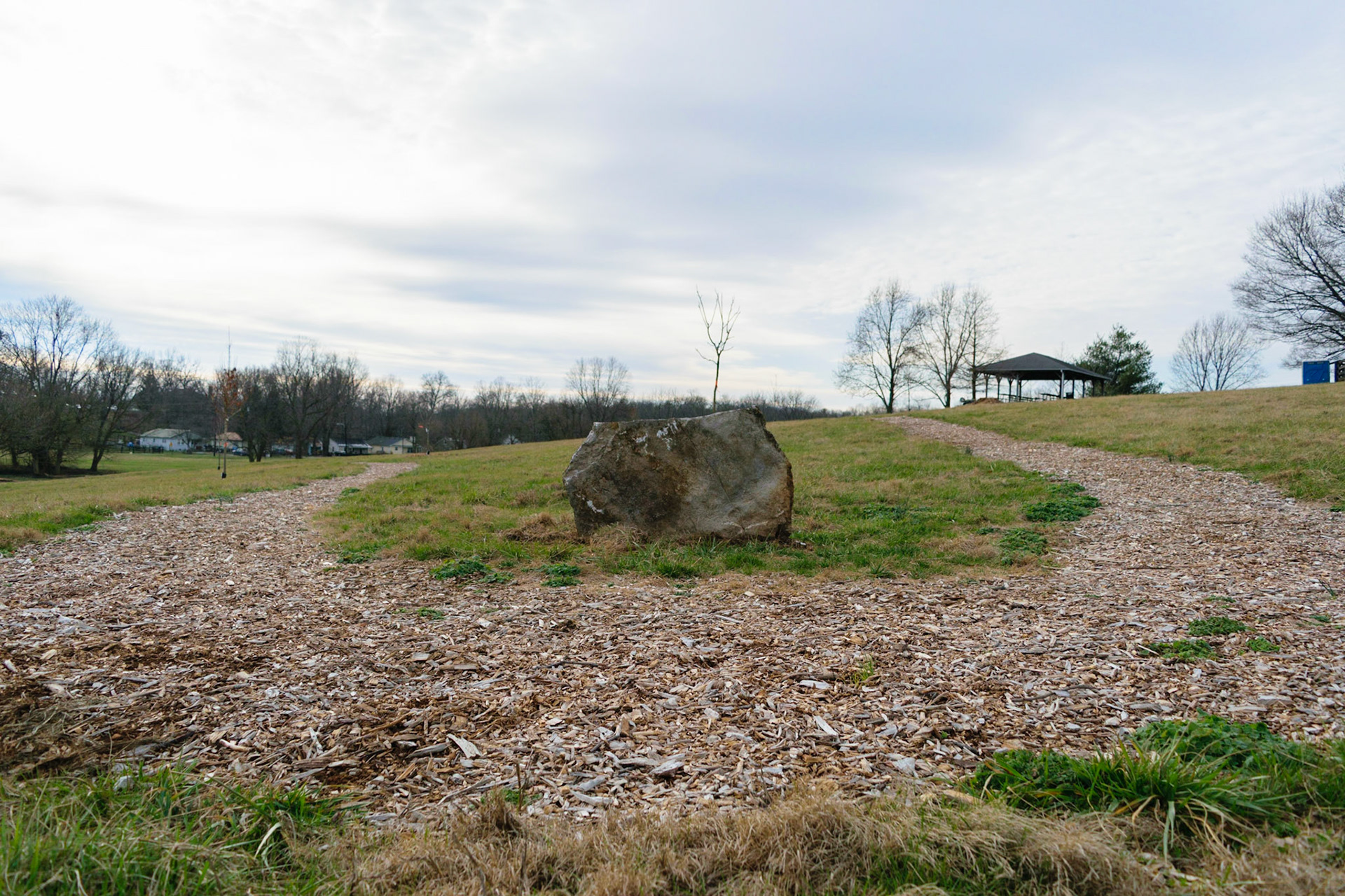 The path looks like it bends around the rock. Reminds me of a stream.