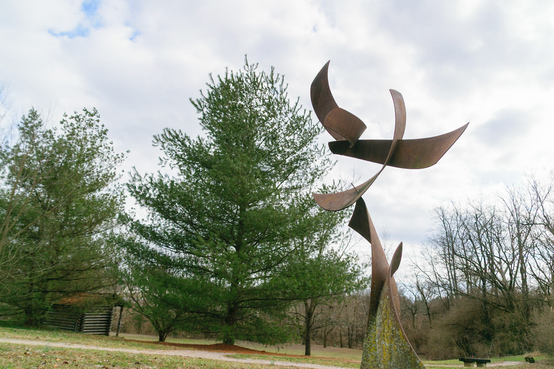 This sculpture almost looks as if it's floating in the air, it's many parts seem to pass through one another.