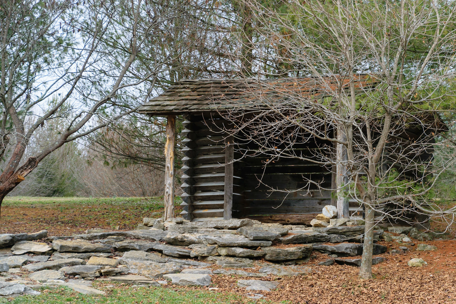 This small cabin is also located in the park tucked into a patch of trees.