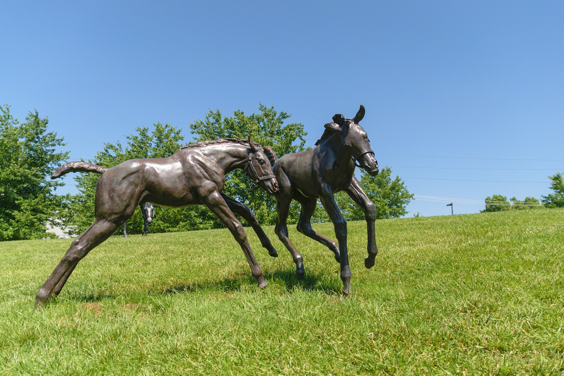 These foles are taking advantage of the beautiful day, even if they're just a statue.