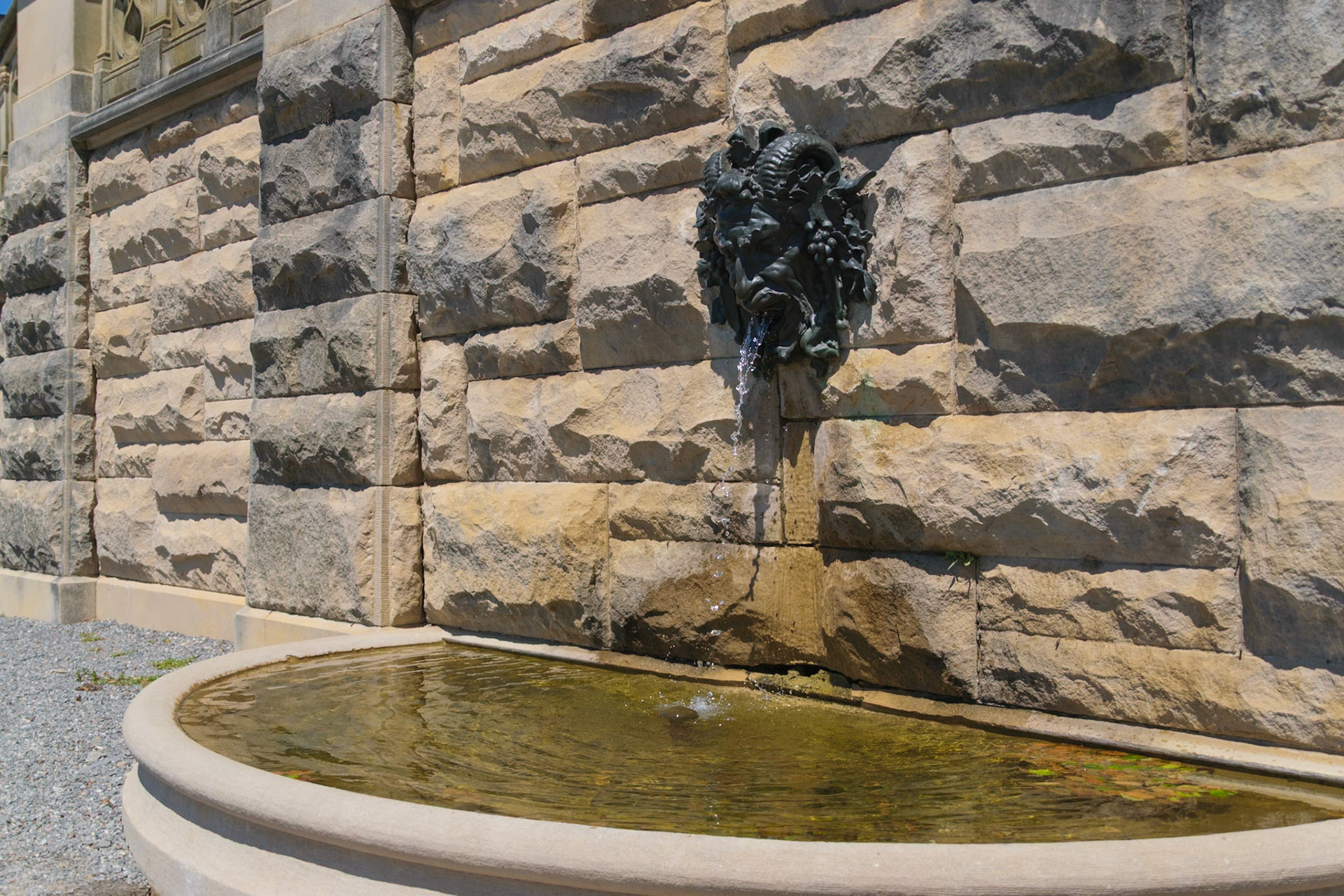 Water continually pours from the mouth of this statue.