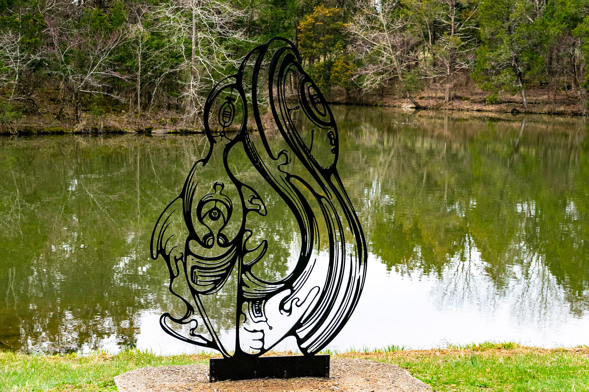 This iron sculpture was sitting by the pond. The swooping shapes remind me of water.
