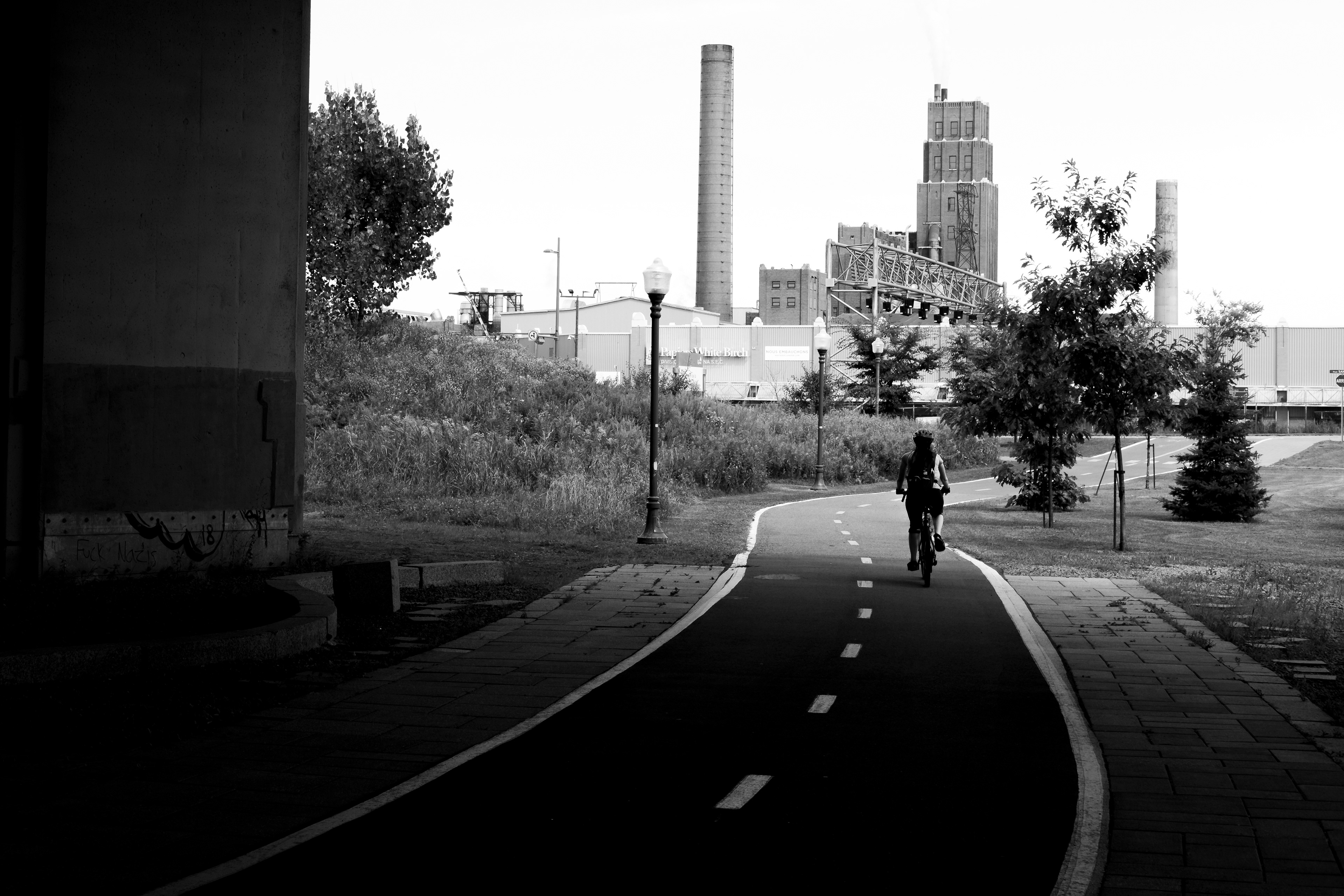 Woman bicycling in Québec city, Québec, August 2019