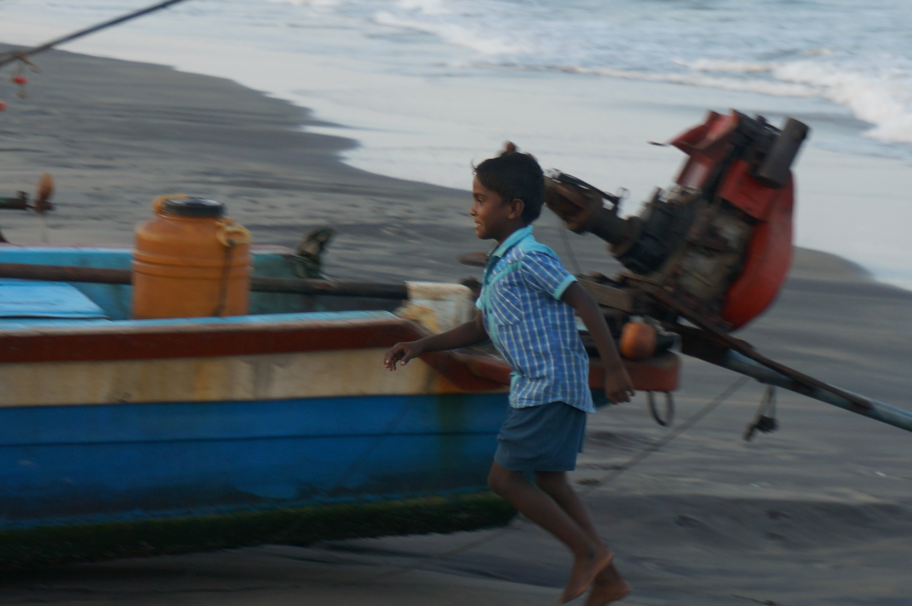 Boy running on the beach of Tharangambadi, or Tranquebar, a coastal city in Tamil Nadu